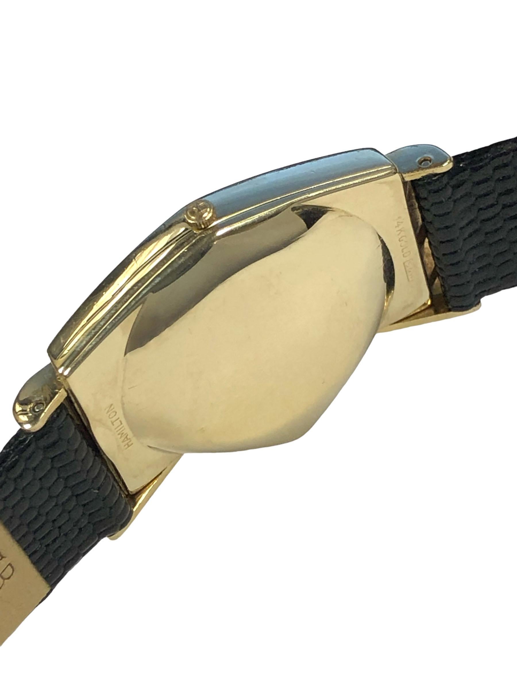 Circa 1960 Hamilton Electric Ventura Wrist Watch, 14k Yellow Gold 2 piece case, Hamilton 505 Electronic movement, Black dial with raised gold dot markers and a sweep seconds hand. New Black Lizard grain strap, comes with a Hamilton Electric