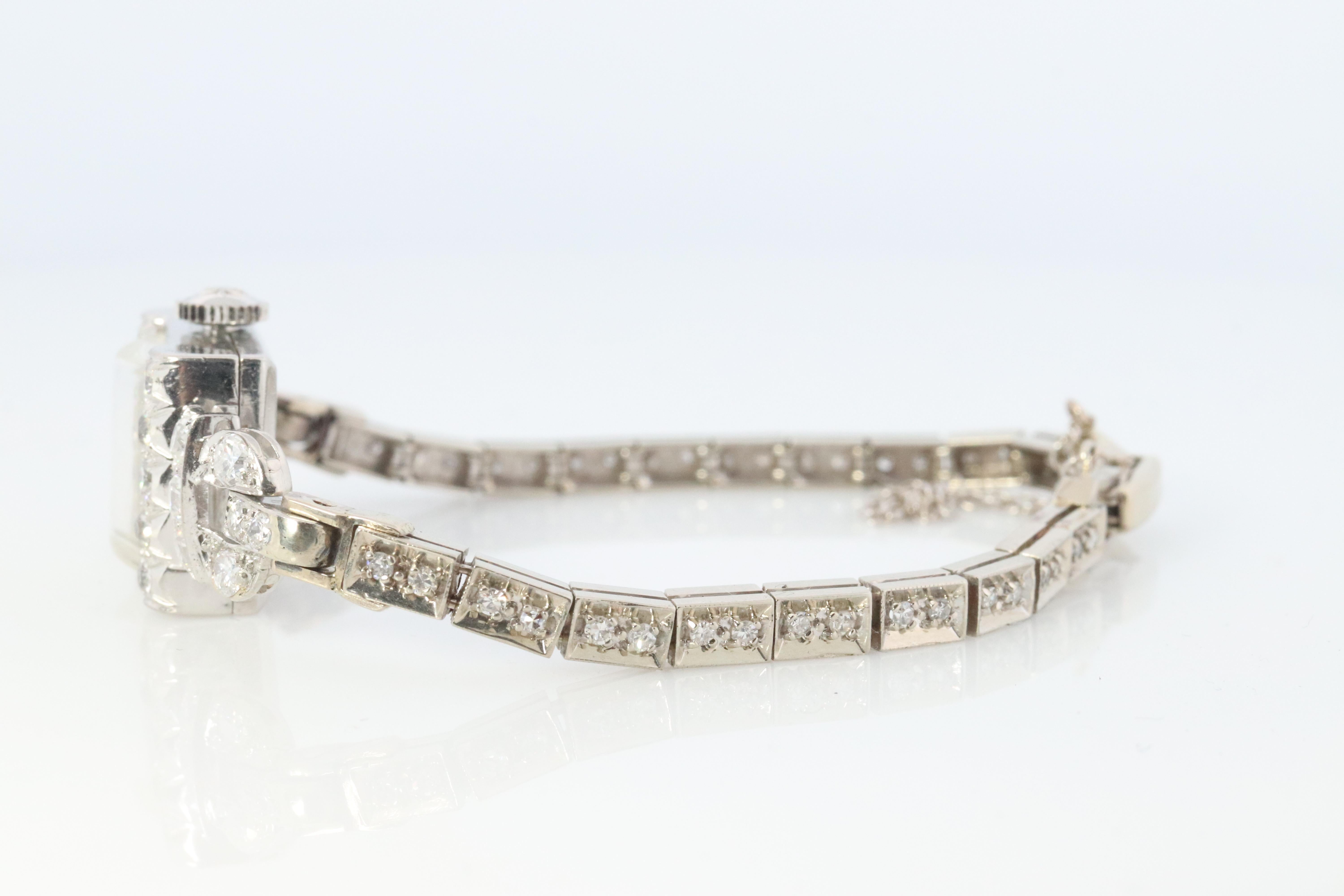 Stunning watch piece.
Hamilton fully mechanical wristwatch.
PLATINUM Case with 14k White Gold Bracelet


Condition: Watch winds up and ticks. Needs daily winding.

Details:
18.4 grams total weight
17mm by 14mm face

Diamonds:
2.5mm 10
3mm 10
2mm