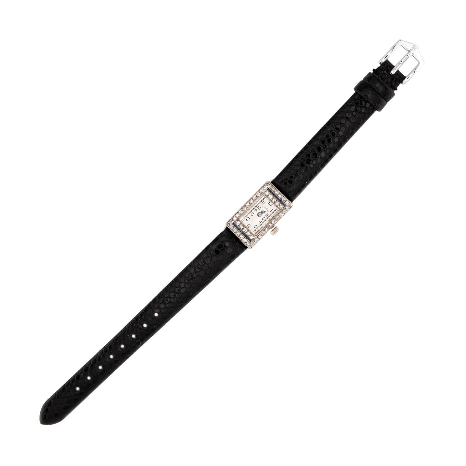 A stunning watch from the Art Deco (ca1920s) era crafted by Hamilton. Crafted in platinum, the case of the watch features two rows of channel set French cut sapphires, which exhibit a lovely deep blue hue. The sapphires are surrounded by an exterior
