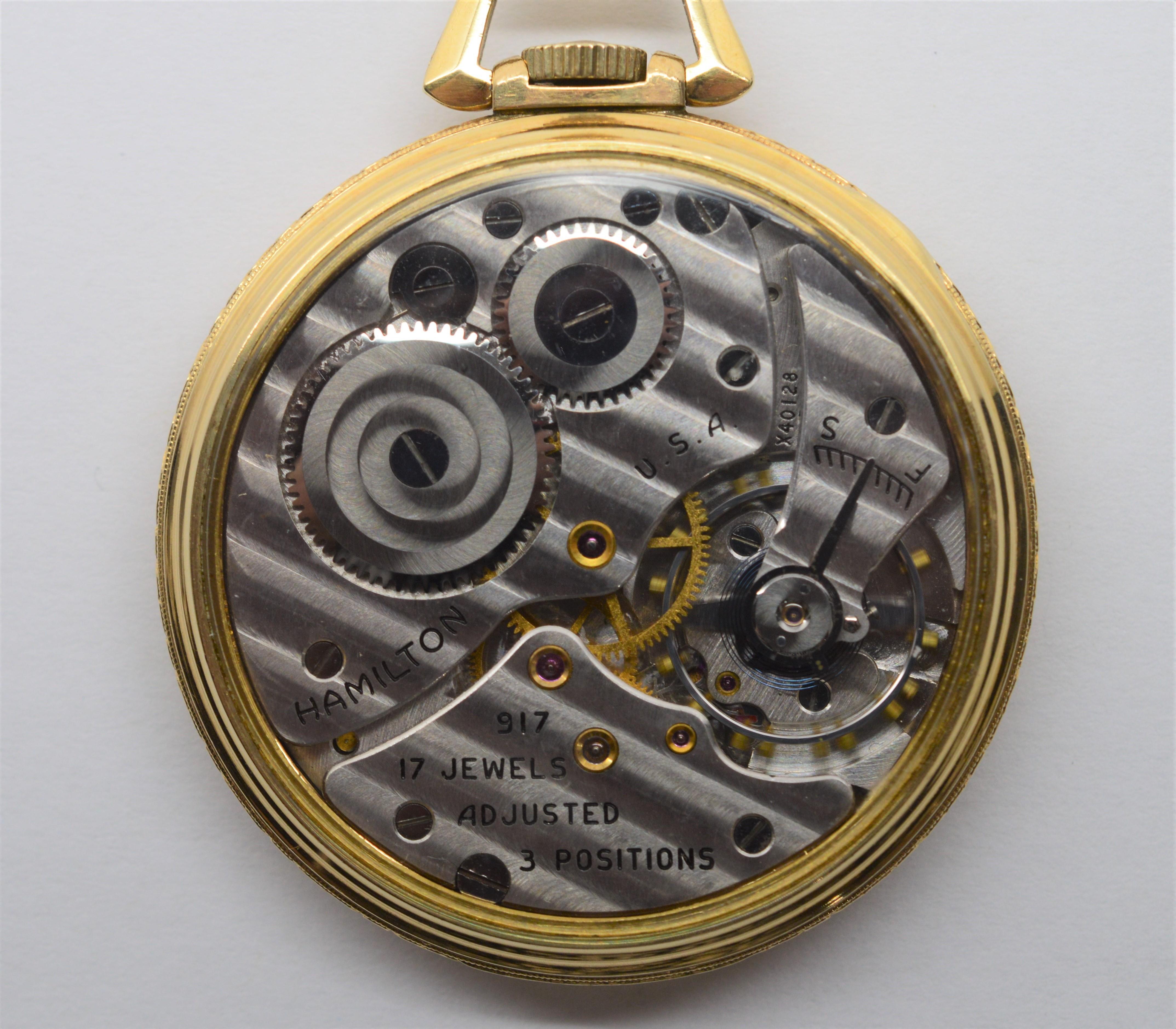 Enjoy seeing the craftsmanship in this Hamilton 917 Brass Pocket Watch, expertly restored with a unique display back allowing the intricate parts of this timepiece to be viewed. Measures 43.8 millimeters. Number X40128, circa 1937 with seventeen