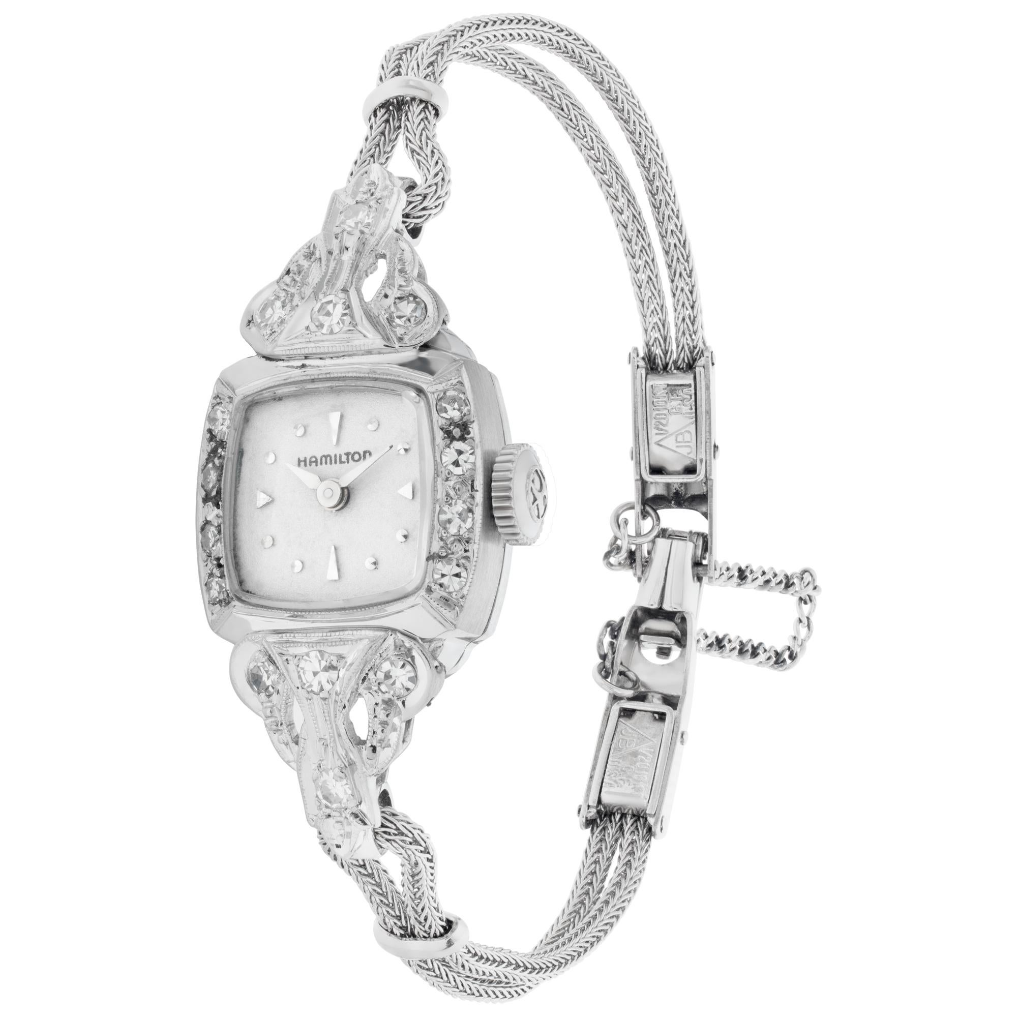 Hamilton Cocktail watch in 14k white gold and 0.45 carats in diamond accents G-H color, VS-SI clarity. Manual. 22 Jewels. Case size 15mm. Circa 1950s. Fine Pre-owned Hamilton Watch. Certified preowned Vintage Hamilton Cocktail watch is made out of