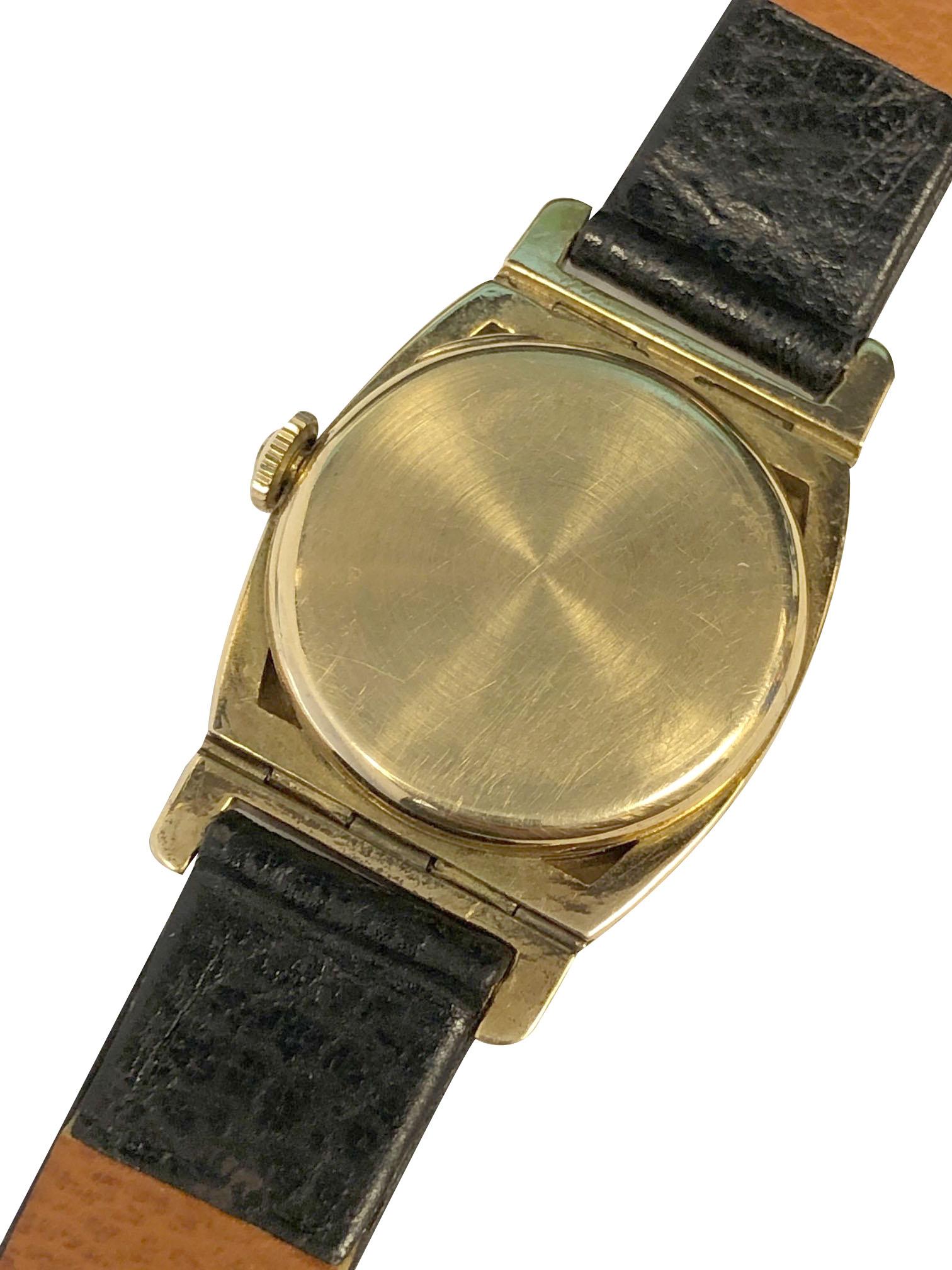 Circa 1930s Hamilton Coronado Wrist Watch, measuring 1 5/8 inches from Lug end to end and 1 1/8 inch wide. 3 Piece 14K Yellow Gold case with Enamel bezel and  flexible lugs. 17 Jewel mechanical, manual wind movement. New Hirsch Black Leather grain