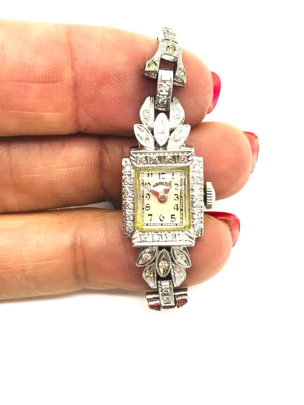 Hamilton, Diamond Encrusted 1920's Watch, 17 Jeweled
 Manual wind movement number 373041a 235484 case number. Dial is in good condition, painted white with black markers<br. (30) round single cut diamonds encrusted bezel of watch and lugs. Total