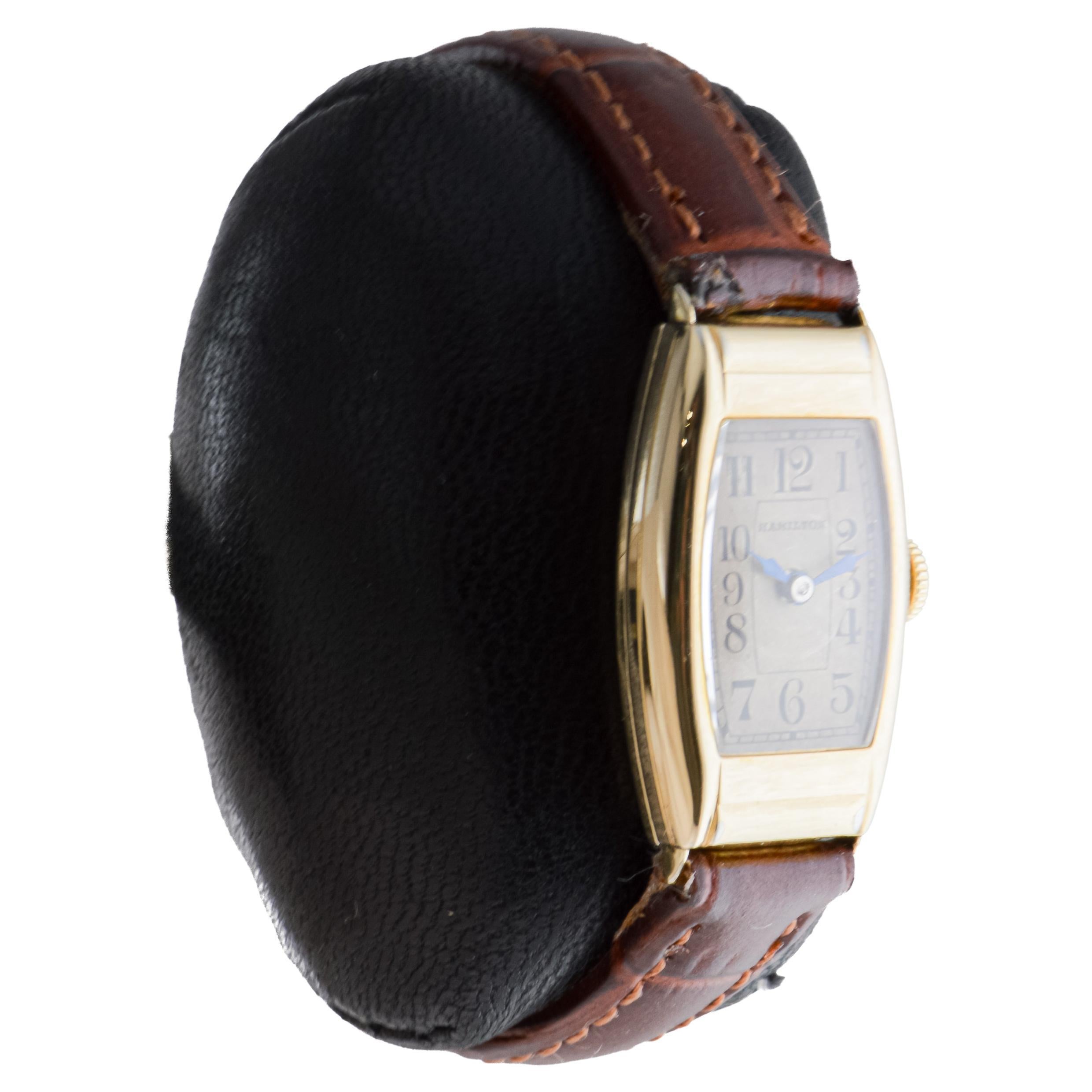 FACTORY / HOUSE: Hamilton Watch Company
STYLE / REFERENCE: Art deco / Tonneau Shape
METAL / MATERIAL: Yellow Gold Filled
CIRCA / YEAR: 1930's
DIMENSIONS / SIZE: Length 32mm X Diameter 16mm
MOVEMENT / CALIBER: Manual Winding / 17 Jewels / Caliber