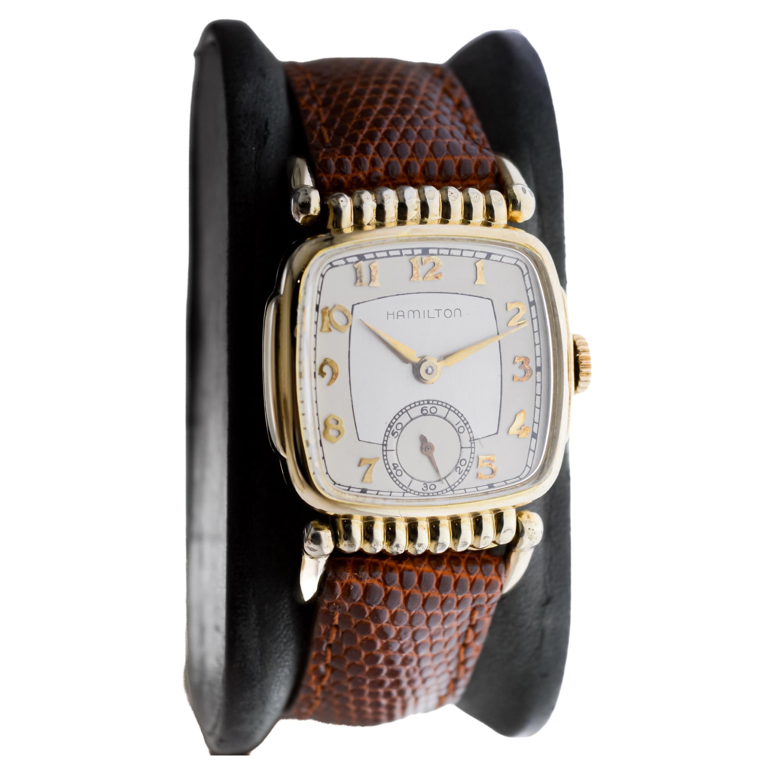 FACTORY / HOUSE: Hamilton Watch Company
STYLE / REFERENCE: Art Deco / Articulated Case
METAL / MATERIAL: Yellow Gold-Filled
CIRCA / YEAR: 1940's
DIMENSIONS / SIZE: Length 51mm X Width 27mm
MOVEMENT / CALIBER: Manual Winding / 17 Jewels / Caliber