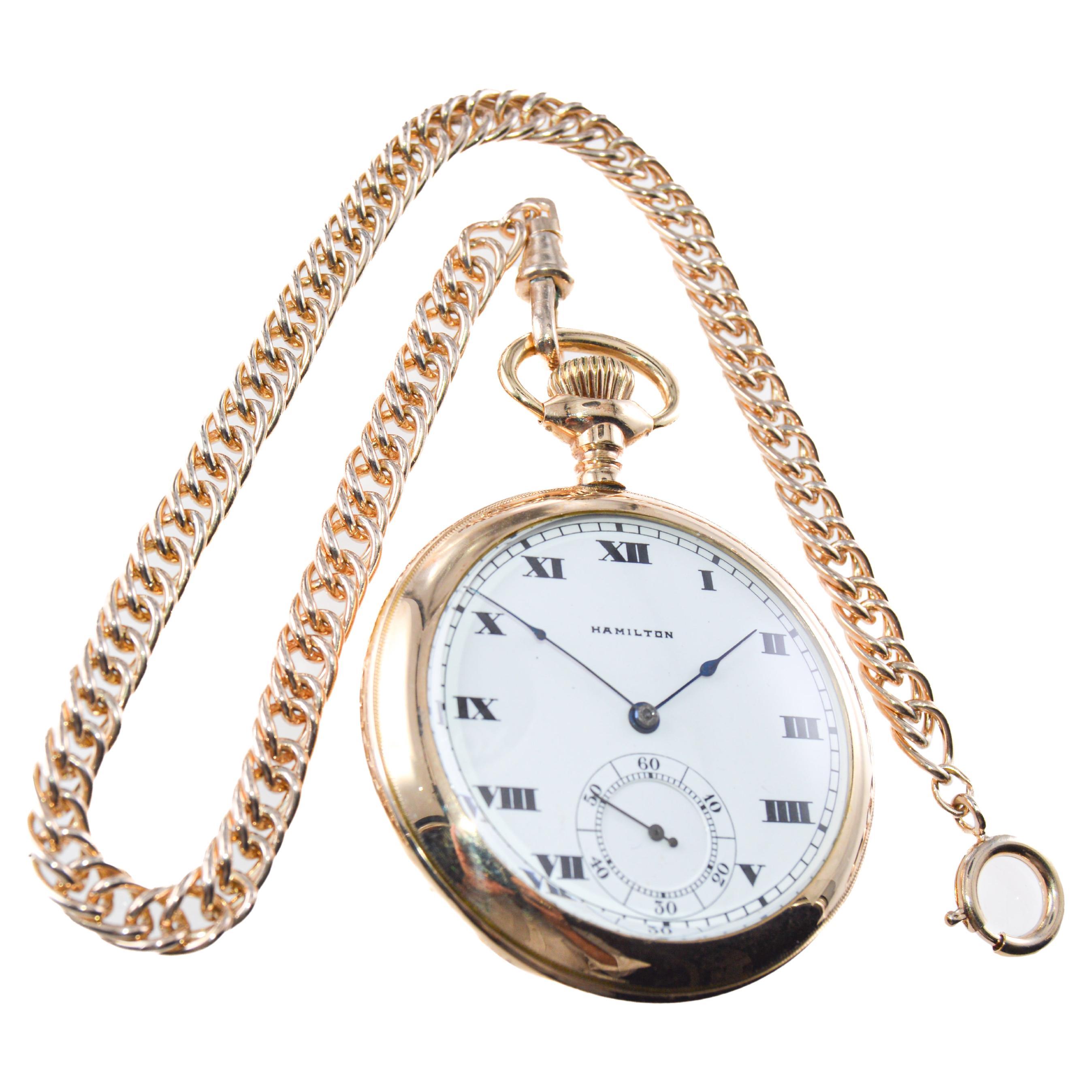 FACTORY / HOUSE: Hamilton Watch Company
STYLE / REFERENCE: Open Faced Pocket Watch
METAL / MATERIAL: Yellow Gold Filled / Hand Engraved Case
CIRCA / YEAR: 1916
DIMENSIONS / SIZE: Diameter 57mm
MOVEMENT / CALIBER: Manual Winding / 17 Jewels / Caliber
