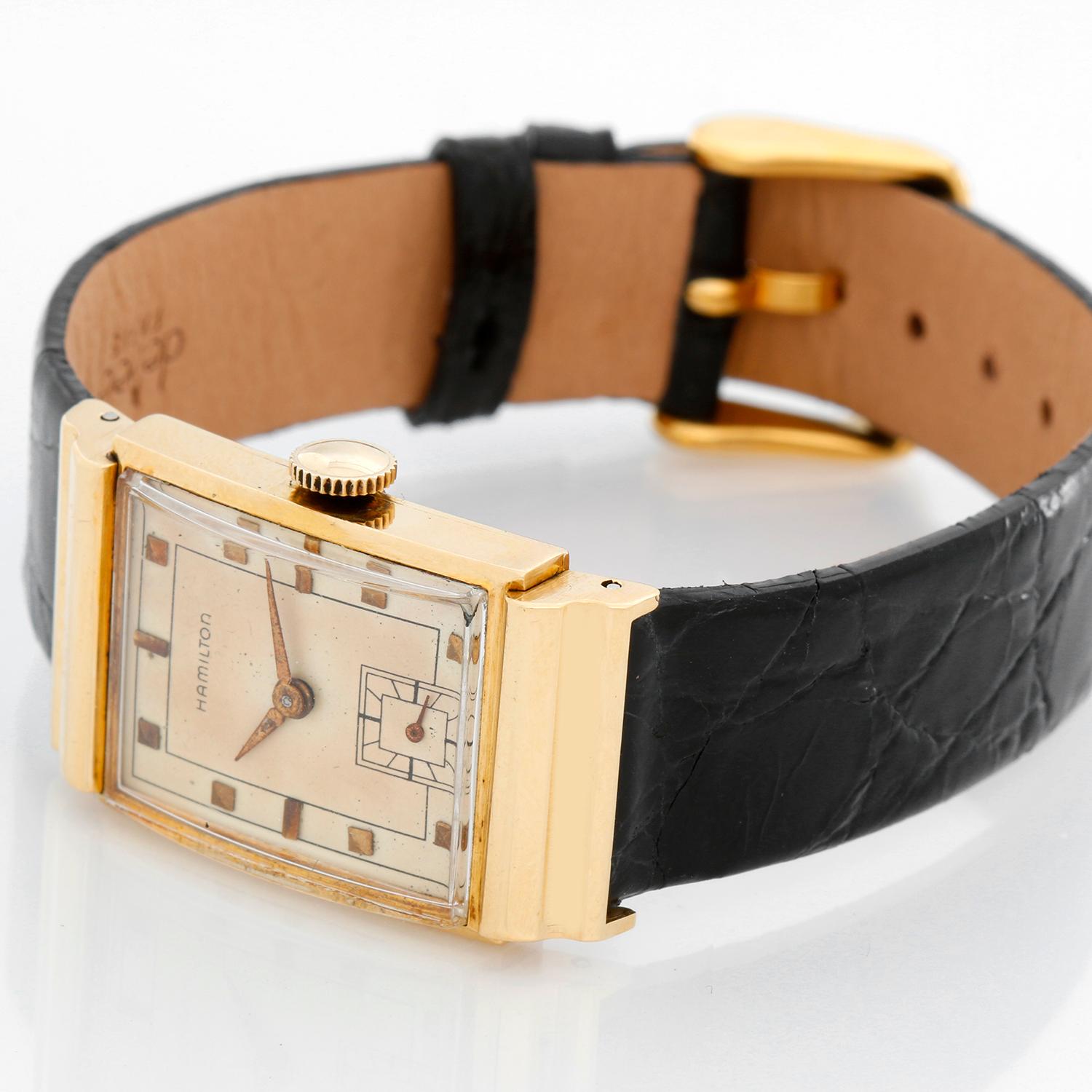 Hamilton Gordon 18k Yellow Gold  Watch - Manual. 18K yellow gold ( 22 x 36 mm ). Nicely patina silver dial with raised gold hour markers. Black strap with tang buckle. Very rare and collectible, one of the few vintage American watches made in 18K.