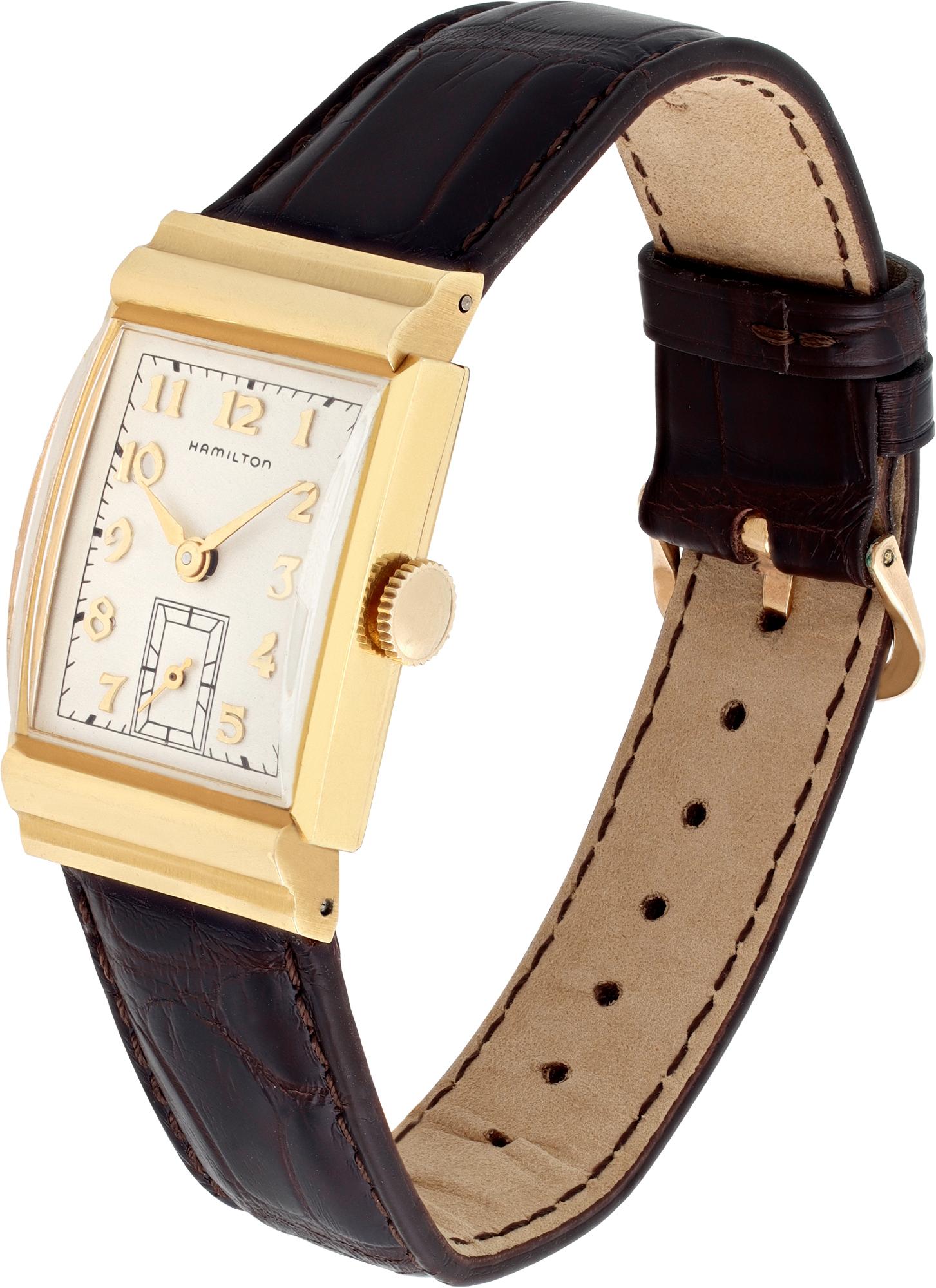 Vintage Hamilton Gordon in 18k yellow gold on a dark brown alligator strap with original 14k tang buckle. Manual wind. Presentation engraving on caseback - Presented to Ralph Brown from Young Spring and Wire Corporation in 1958. Comes with original