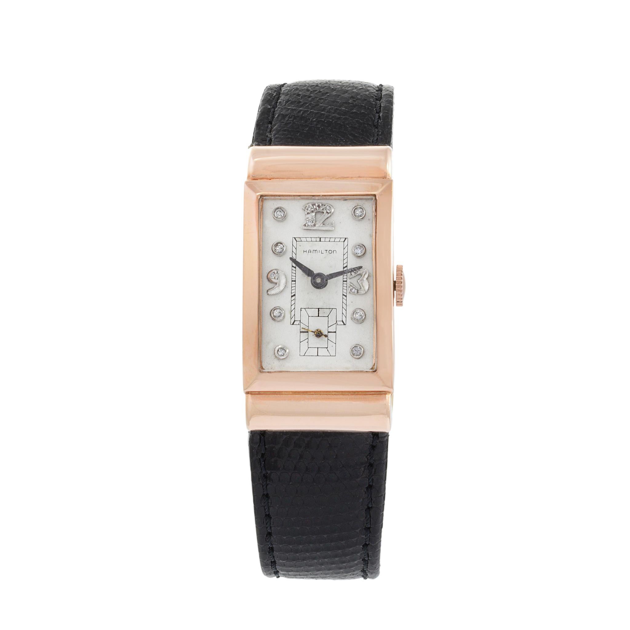This is a rare 1950's Hamilton 14k rose gold hooded lug tank watch with diamond dial. This tank is large for the period at 21mm in diameter and 40mm lug to lug.

This watch is powered by a Hamilton caliber 982 19 jewel movement. This was one of the