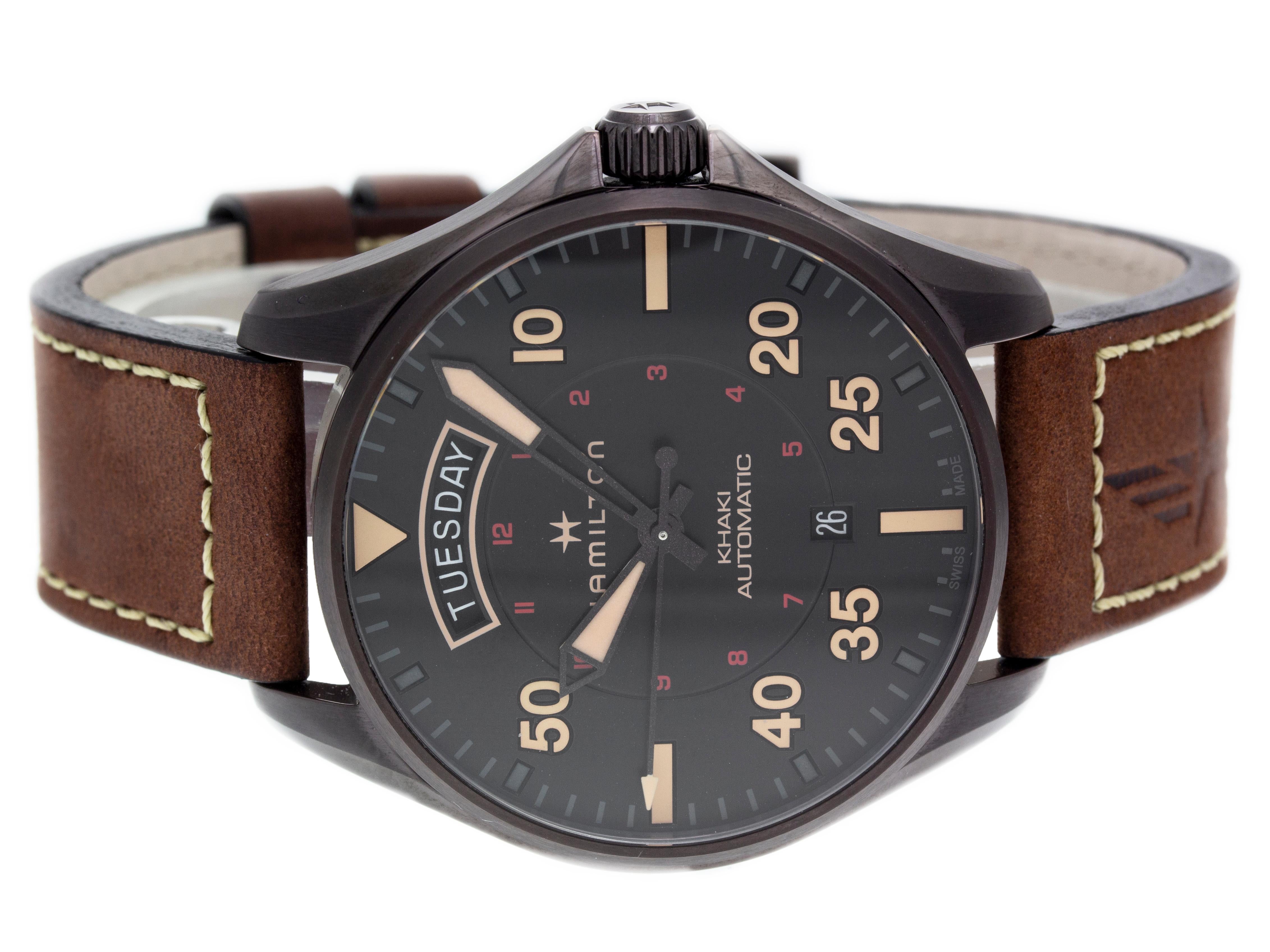 Brown PVD steel Hamilton Khaki Pilot Day Date automatic watch with a 42mm case, black dial, and brown leather strap with tang buckle. Features include hours, minutes, seconds, day, and date. Comes with a Deluxe Gift Box and 2 Year Store