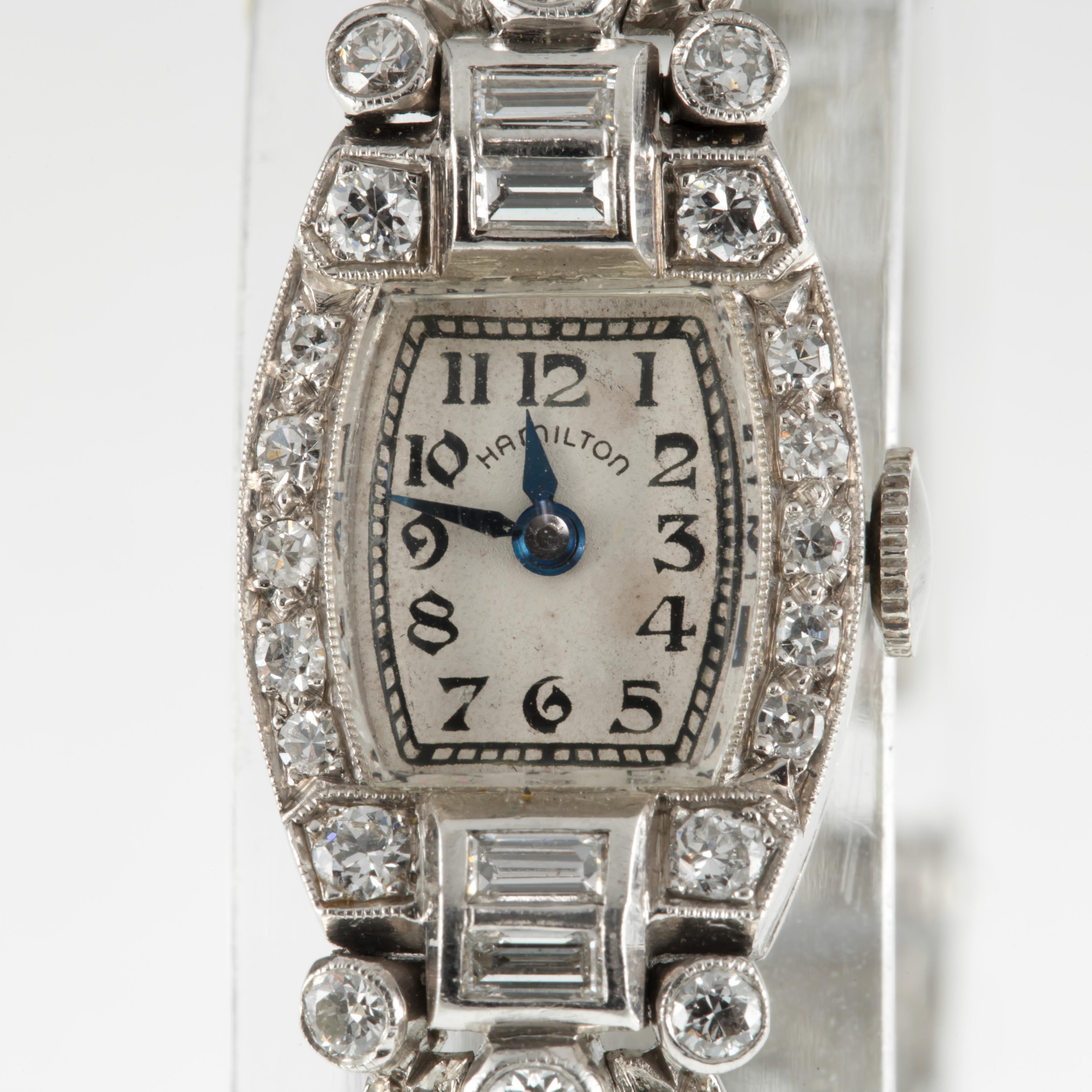 Hamilton Ladies Platinum Diamond Dress Watch Delicate Filigree Mov #911
Movement #911
Serial #T73771
Year of Manufacture: 1939
Platinum Tonneau Case w/ Diamond Accents
14 mm Wide (15 mm w/ Crown)
17 mm Long
Lug-to-Lug Length = 28 mm
Lug-to-Lug Width