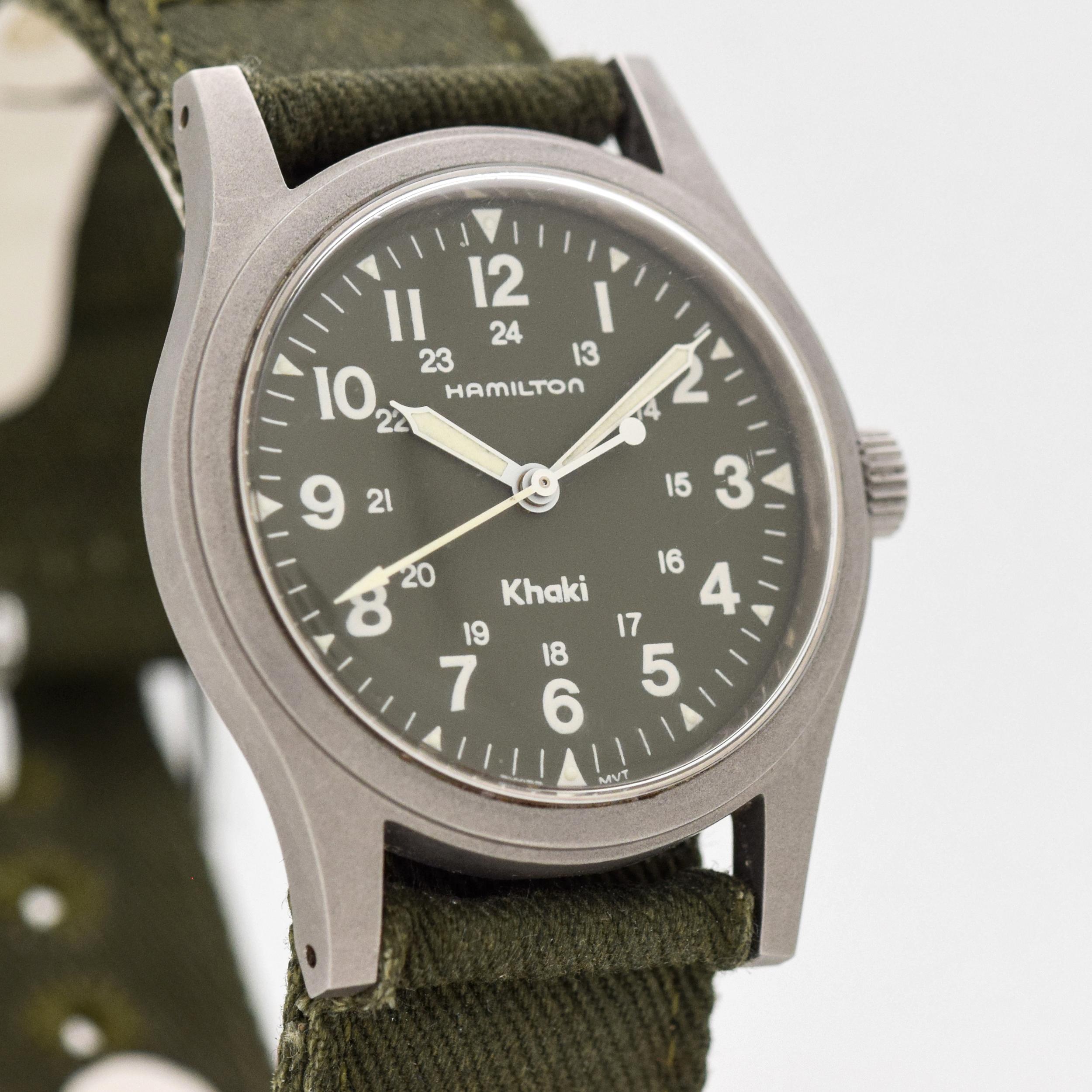 1980's - 1990's Vintage Hamilton Khaki Ref. 9415A Military Style Steel watch with Original Green Dial with White Arabic Numbers. Case size, 32mm x 38mm lug to lug (1.26 in. x 1.5 in.) - Powered by a 17-jewel, manual caliber ETA movement. Triple