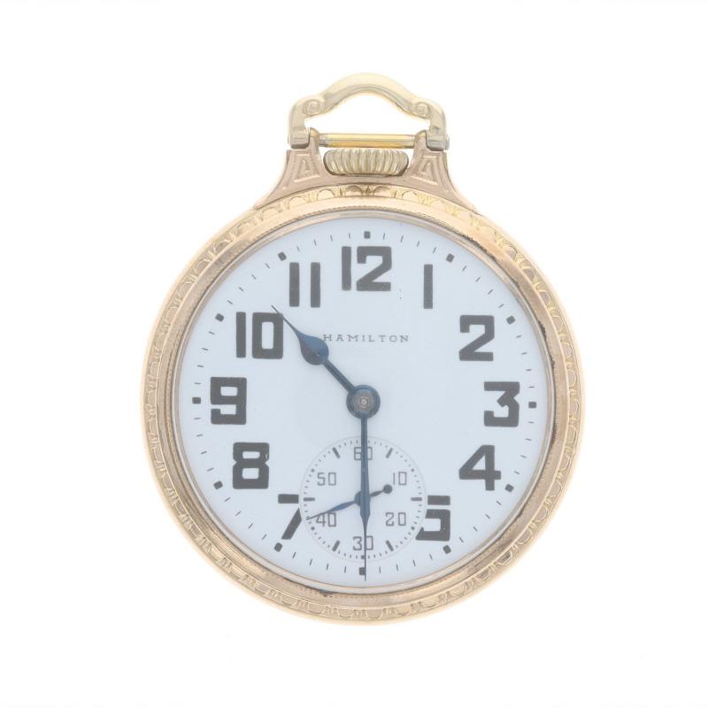 Brand: Hamilton
Model: 5
Movement: Mechanical
Number of Jewels: 21
Year: 1948
Movement Maker: United States
Dial Color: White

Grade: 992B 
Size: 16s

Metal Content: 10k Gold Filled

Style: Open Face
Features: 
Numbers marking the hours 
Sub