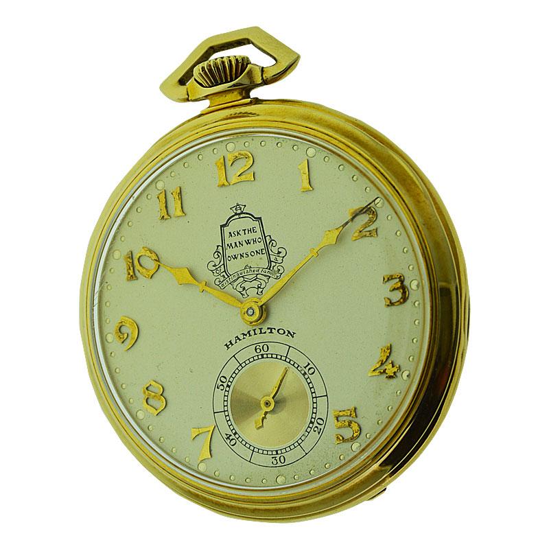 FACTORY / HOUSE: Hamilton Watch Company
STYLE / REFERENCE: Open Faced Pocket Watch
METAL / MATERIAL: Yellow Gold Filled
CIRCA / YEAR: 1936
DIMENSIONS / SIZE: 45mm
MOVEMENT / CALIBER: Manual Winding / 23 Jewels / Caliber 922
DIAL / HANDS: Original