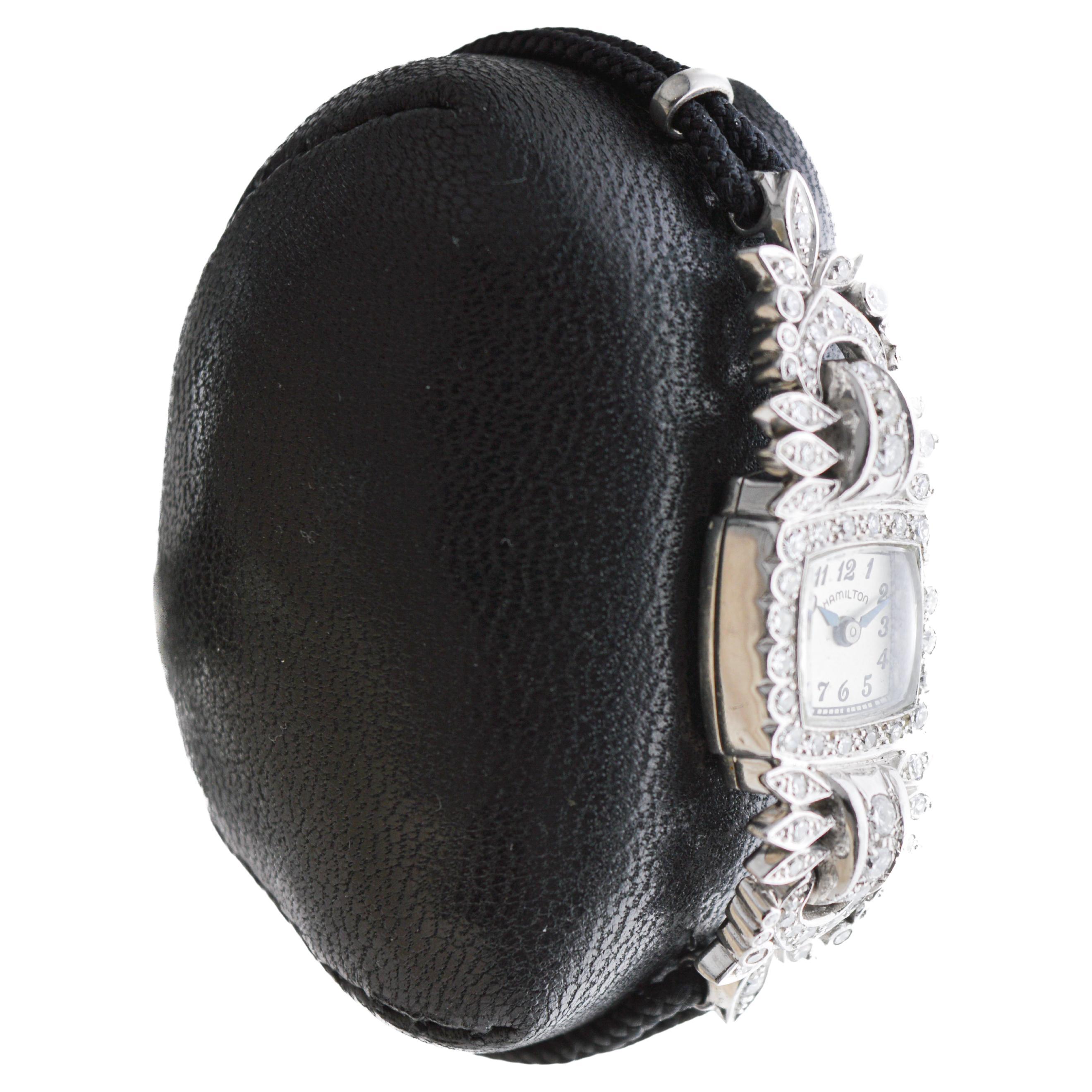 FACTORY / HOUSE: Hamilton Watch Company
STYLE / REFERENCE: Art Deco / Cushion Shape 
METAL / MATERIAL: Platinum / 1.25 Cts. 
CIRCA / YEAR: 1940's
DIMENSIONS / SIZE: Length 51mm X Width 15mm
MOVEMENT / CALIBER: Manual Winding / 17 Jewels / Caliber