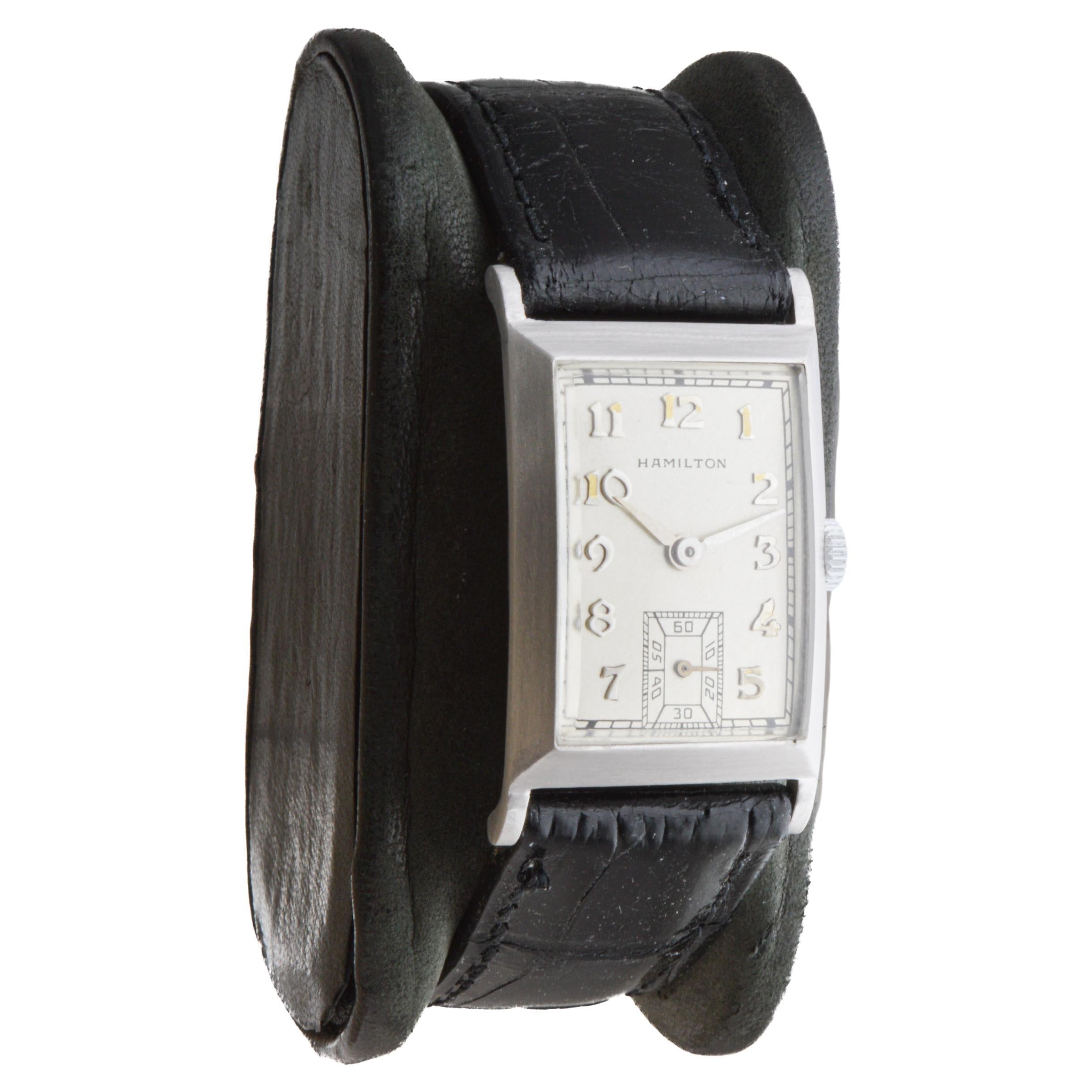 FACTORY / HOUSE: Hamilton Watch Company
STYLE / REFERENCE: Art Deco / Tank Style 
METAL / MATERIAL: Platinum
CIRCA / YEAR: 1940's
DIMENSIONS / SIZE: Length 37mm X Width 22mm
MOVEMENT / CALIBER: Manual Winding / 19 Jewels / Caliber 982 19 Jewels