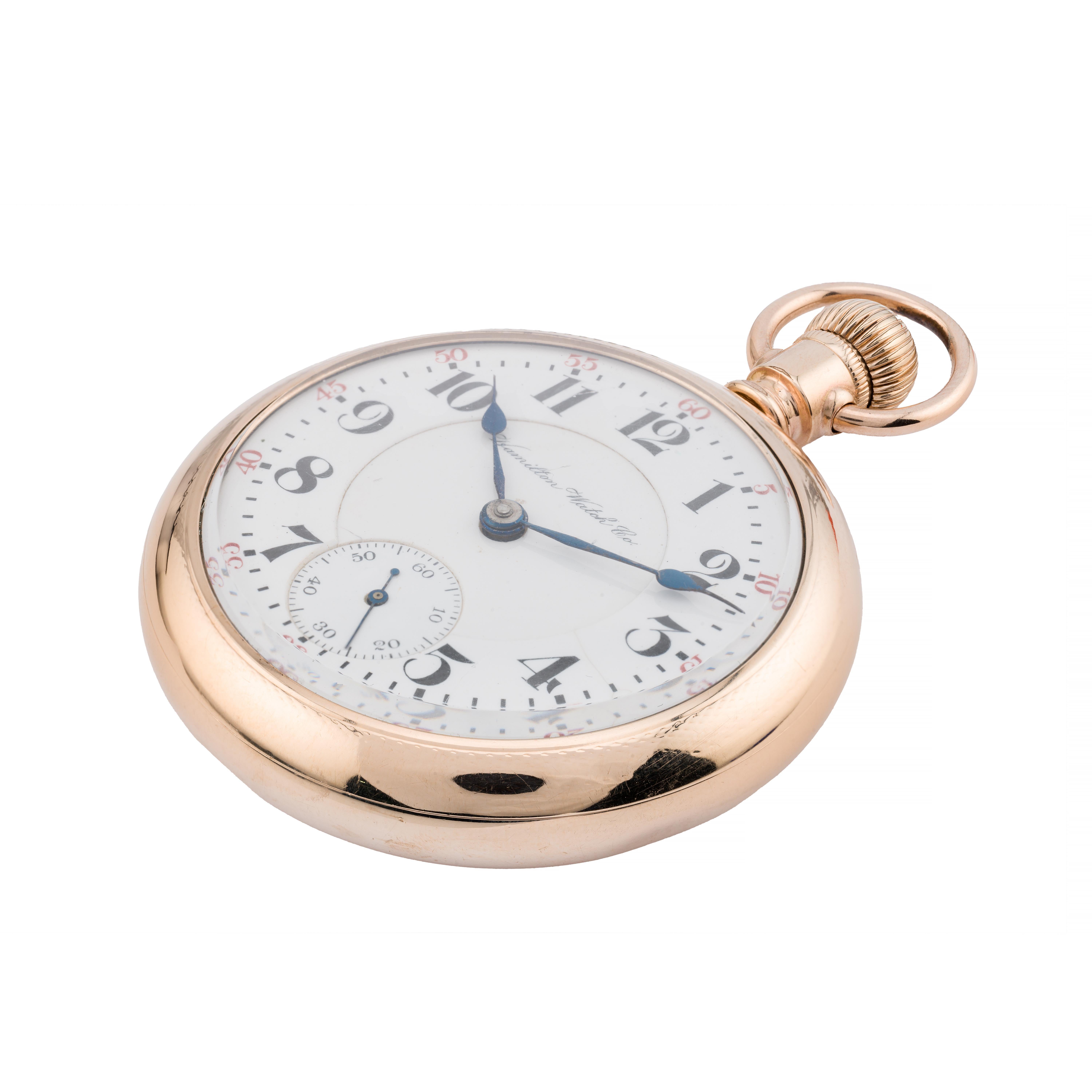 Aston Estate Jewelry Presents:

A classic Hamilton railroad pocket watch crafted in gold-filled.

The round watch features a pristine white double sunk porcelain dial with bold black numerals and a small seconds subdial at 6 o'clock. The Hamilton