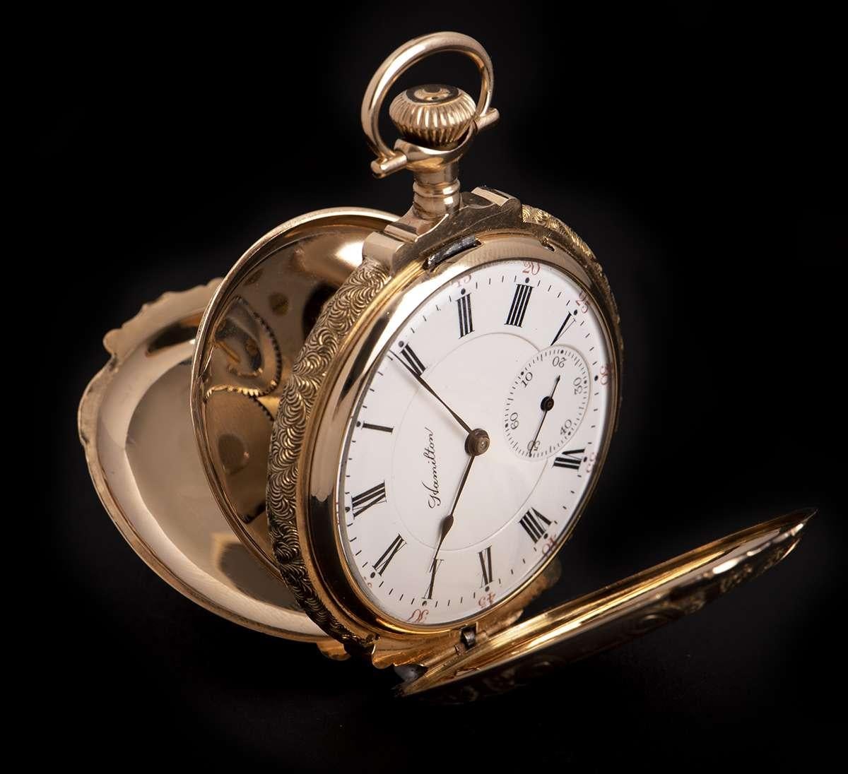 A Rare 50 mm 14k Tri-Gold Full Hunter Vintage Gents Pocket Watch, white enamel dial with roman numerals, small seconds at 6 0'clock, a fixed 14k tri-gold bezel, plastic glass, an 14k tri-gold case with a stags head and floral motif design, an 14k