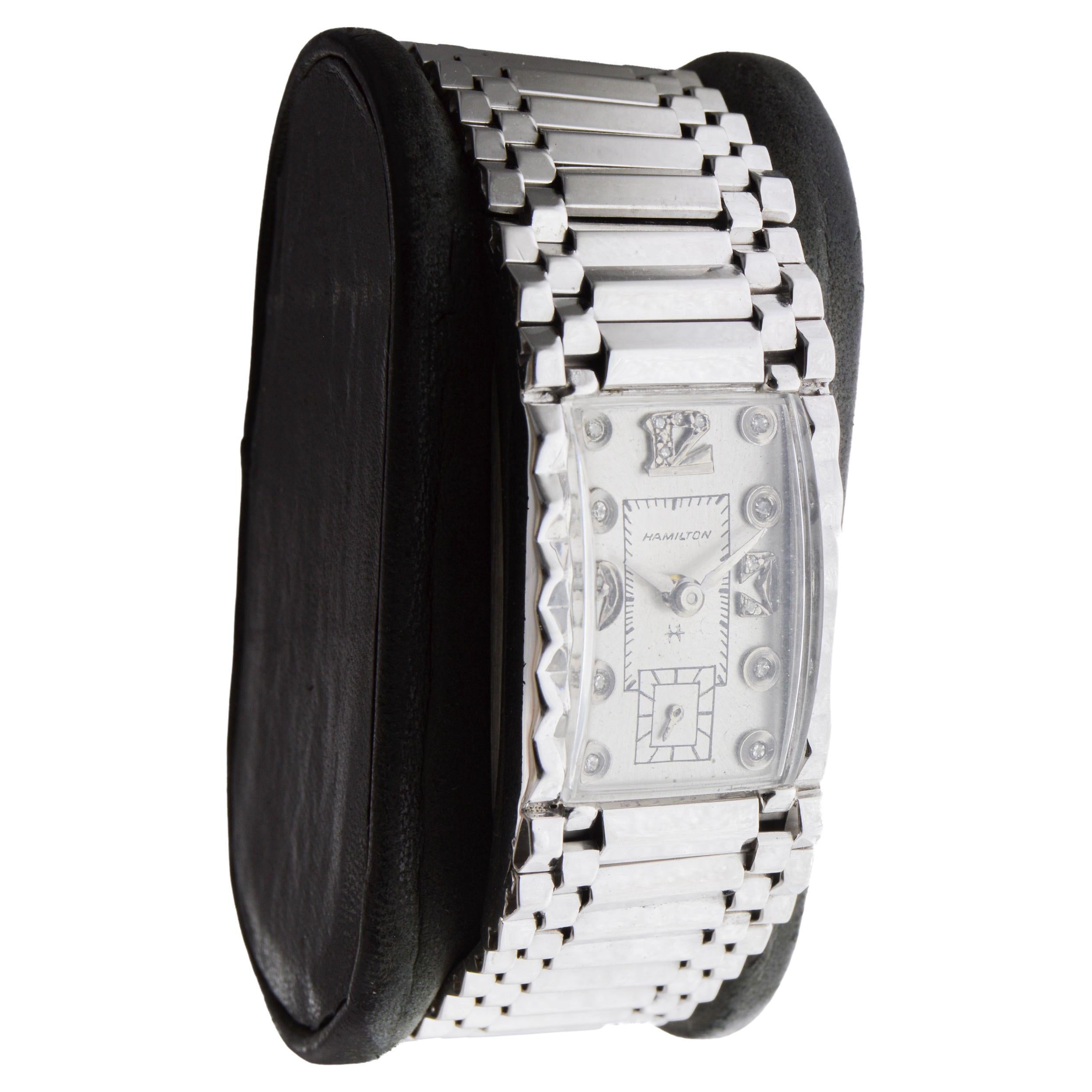 FACTORY / HOUSE: Hamilton Watch Company
STYLE / REFERENCE: Art Deco / Hand Constructed Case
METAL / MATERIAL: 14Kt. Solid White Gold
DIMENSIONS: Length 35mm  X Width 20mm
CIRCA / Date: 1940's
MOVEMENT / CALIBER: Manual Winding / 17 Jewels 
DIAL /