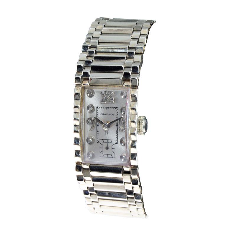 FACTORY / HOUSE: Hamilton Watch Company
STYLE / REFERENCE: Art Deco / Hand Constructed Case
METAL / MATERIAL: 14Kt. Solid White Gold
DIMENSIONS: Length 35mm  X Width 20mm
CIRCA / Date: 1940's
MOVEMENT / CALIBER: Manual Winding / 17 Jewels 
DIAL /