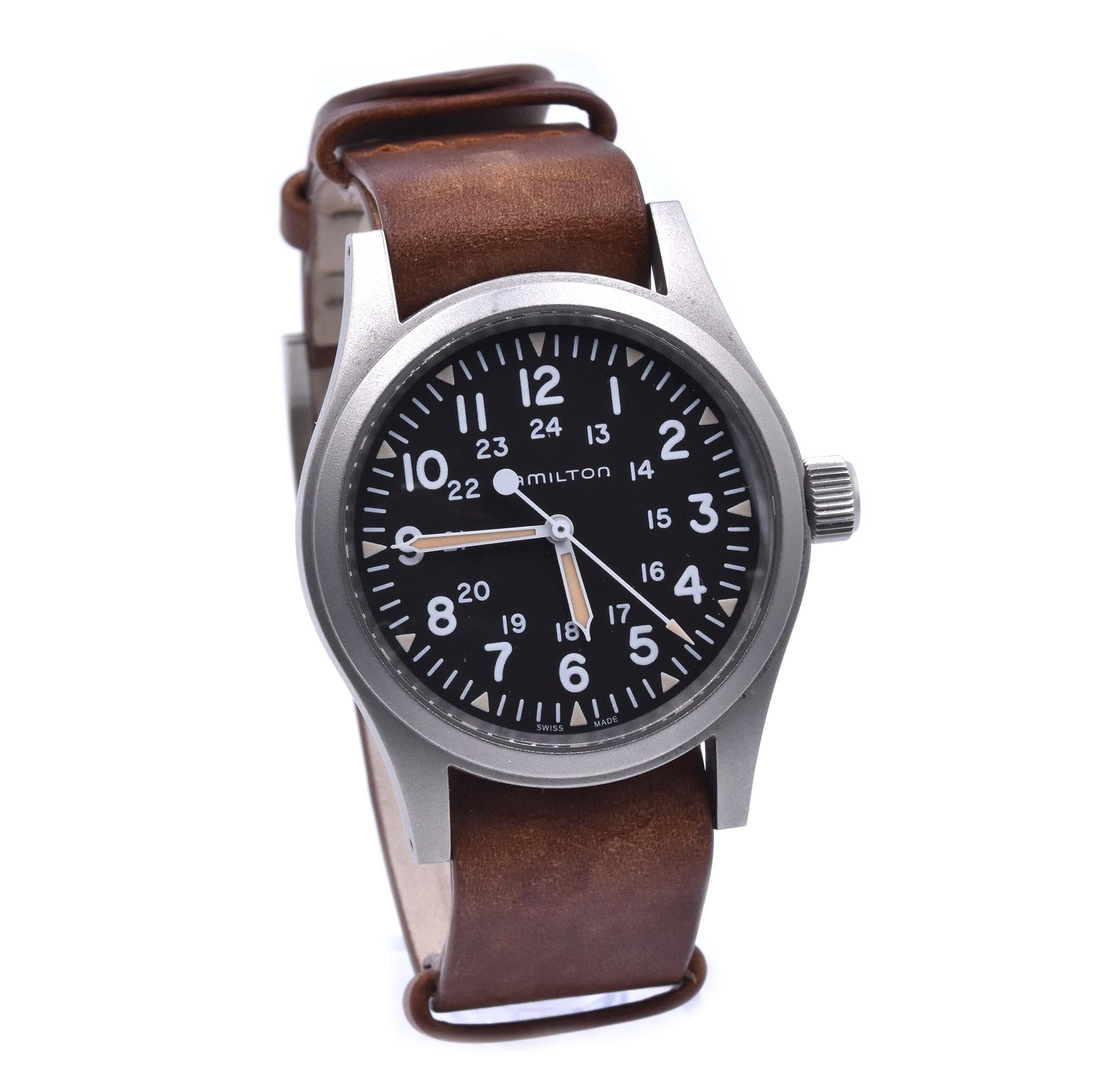 Movement: manual wind
Function: hours, minutes
Case: 14.20mm x 18mm case, diamonds set in case
Dial: black dial, arabic numerals
Band: brown leather strap with buckle
Serial # NCWEJZXXX
Reference # H694390

Does not come with original box or