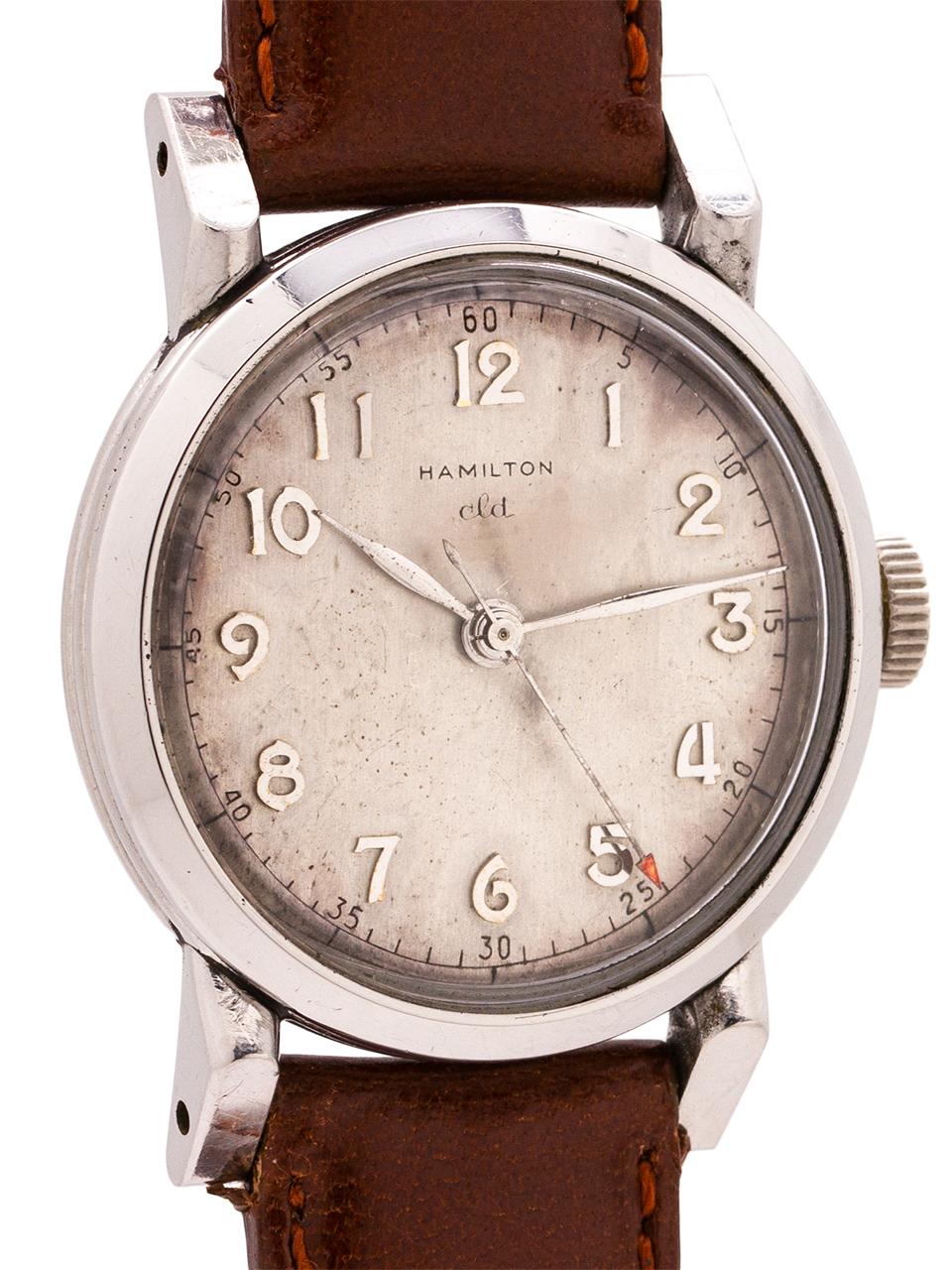 Hamilton vintage man’s manual wind watch, circa 1950. This classic design stainless steel case measures 30mm, with bold angled lugs and snap back. The dial is easily the most interesting part of this Hamilton, with its satin silver having aged to a