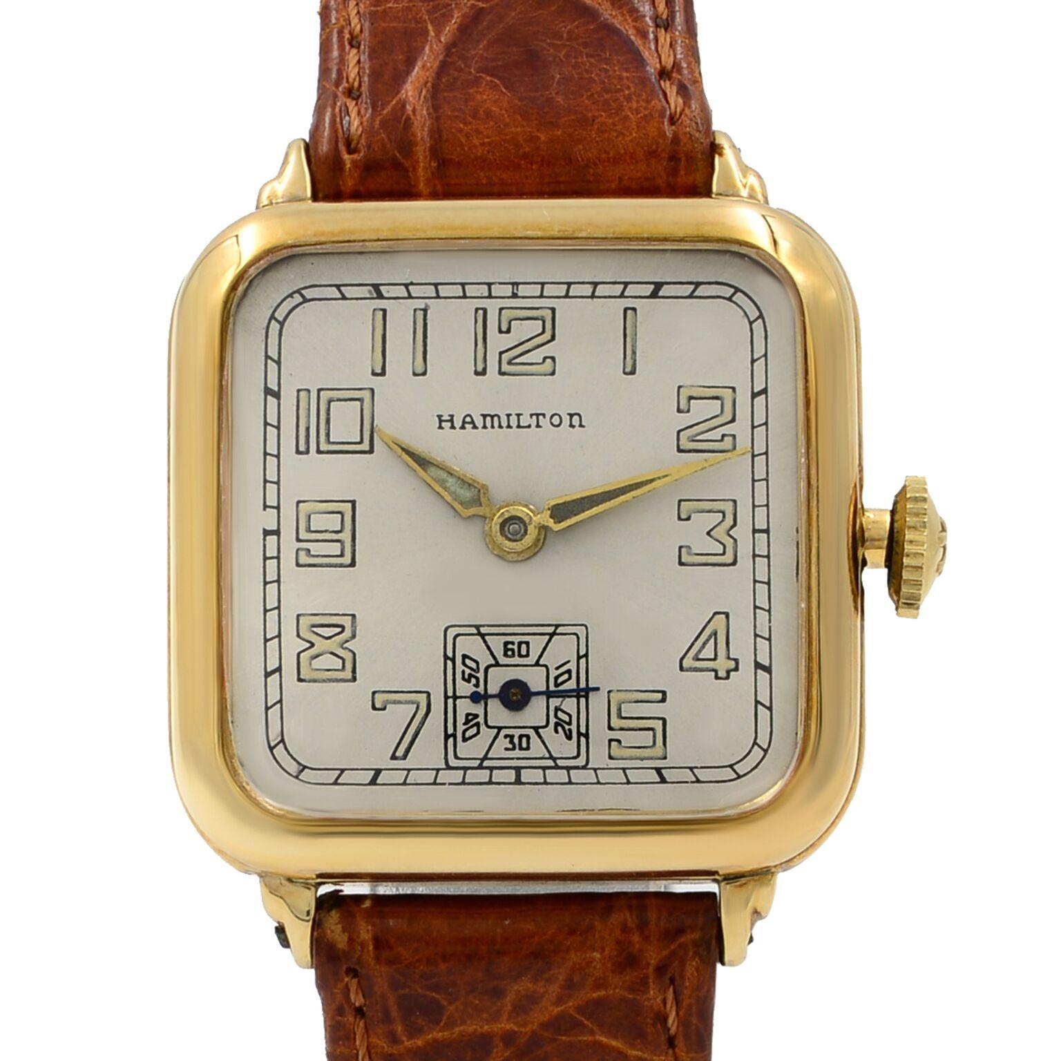 This pre-owned Hamilton   is a beautiful Unisex timepiece that is powered by a mechanical movement which is cased in a yellow gold case. It has a round shape face, small seconds subdial dial and has hand arabic numerals style markers. It is