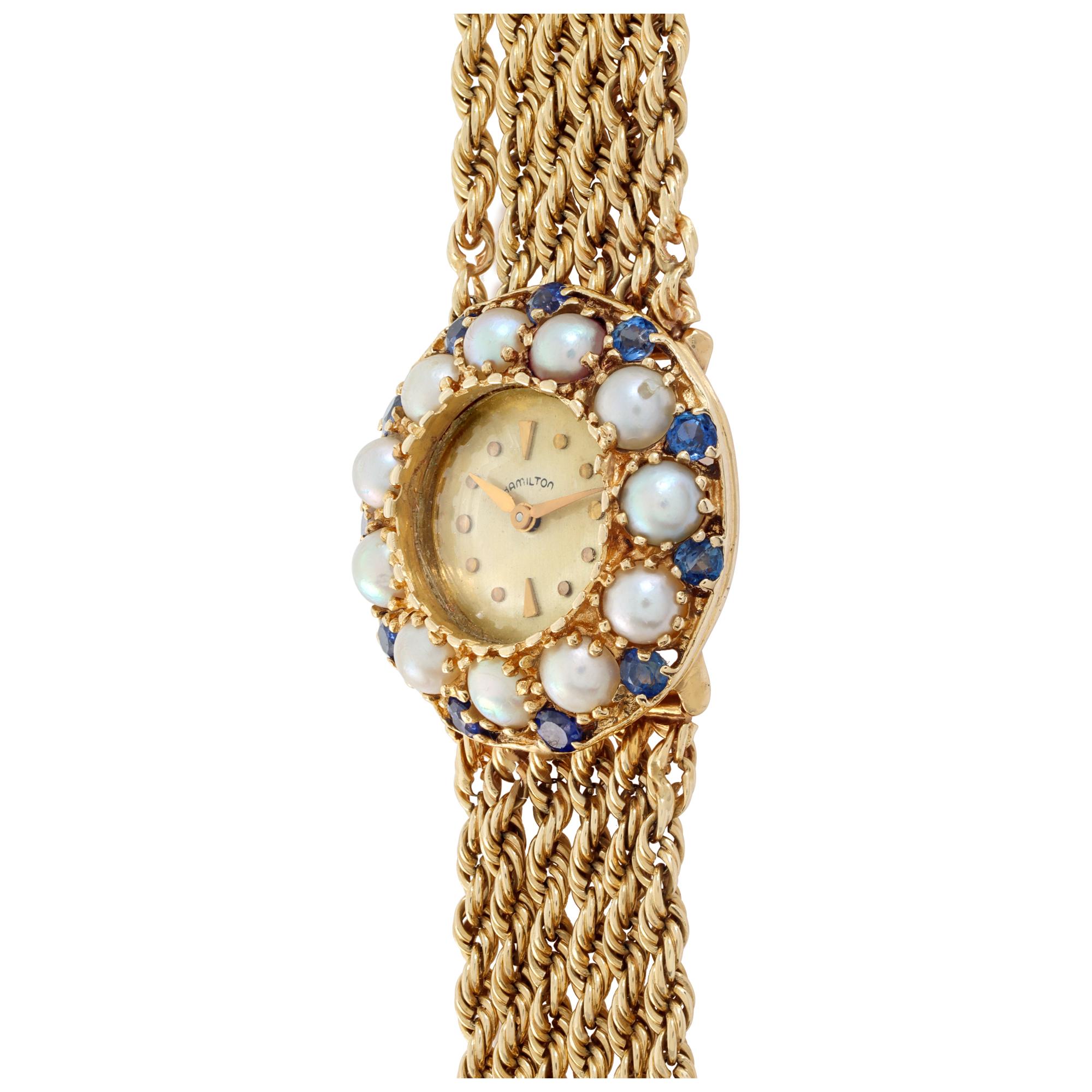 Vintage Hamilton watch on six strands chain style bracelet. Dial of the watch surrounded by sapphires and pearls bezel. Case size 26mm. Manual wind. Fits 6 inches wrist. Circa 1950s.
