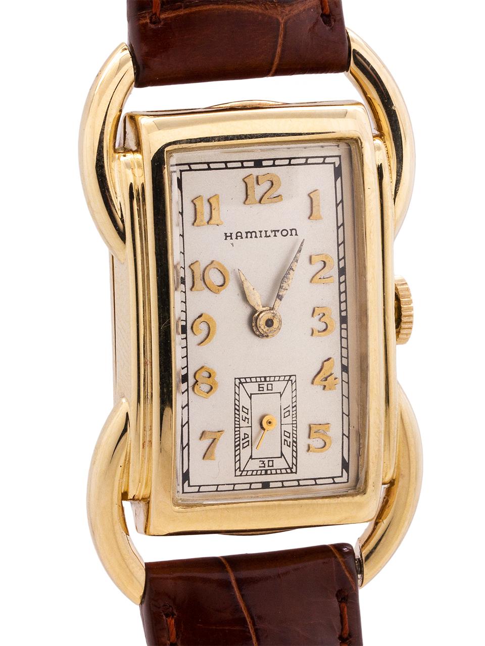 
Vintage man’s Hamilton 14K YG “Bentley” model. The Bentley is one of the most distinctive case designs of the early Hamilton models with prominent curved tubes on each side of the case and extending beyond the case to form the lugs. The watch