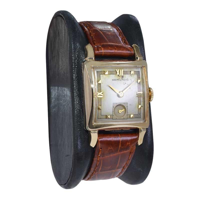 FACTORY / HOUSE: Hamilon Watch Company
STYLE / REFERENCE: Art Deco / Tank Style 
METAL / MATERIAL: Yellow Gold Filled
CIRCA / YEAR: 1950's
DIMENSIONS / SIZE: Length 24mm x Width 38mm
MOVEMENT / CALIBER: Manual Winding / 17 Jewels / Cal.752
DIAL /