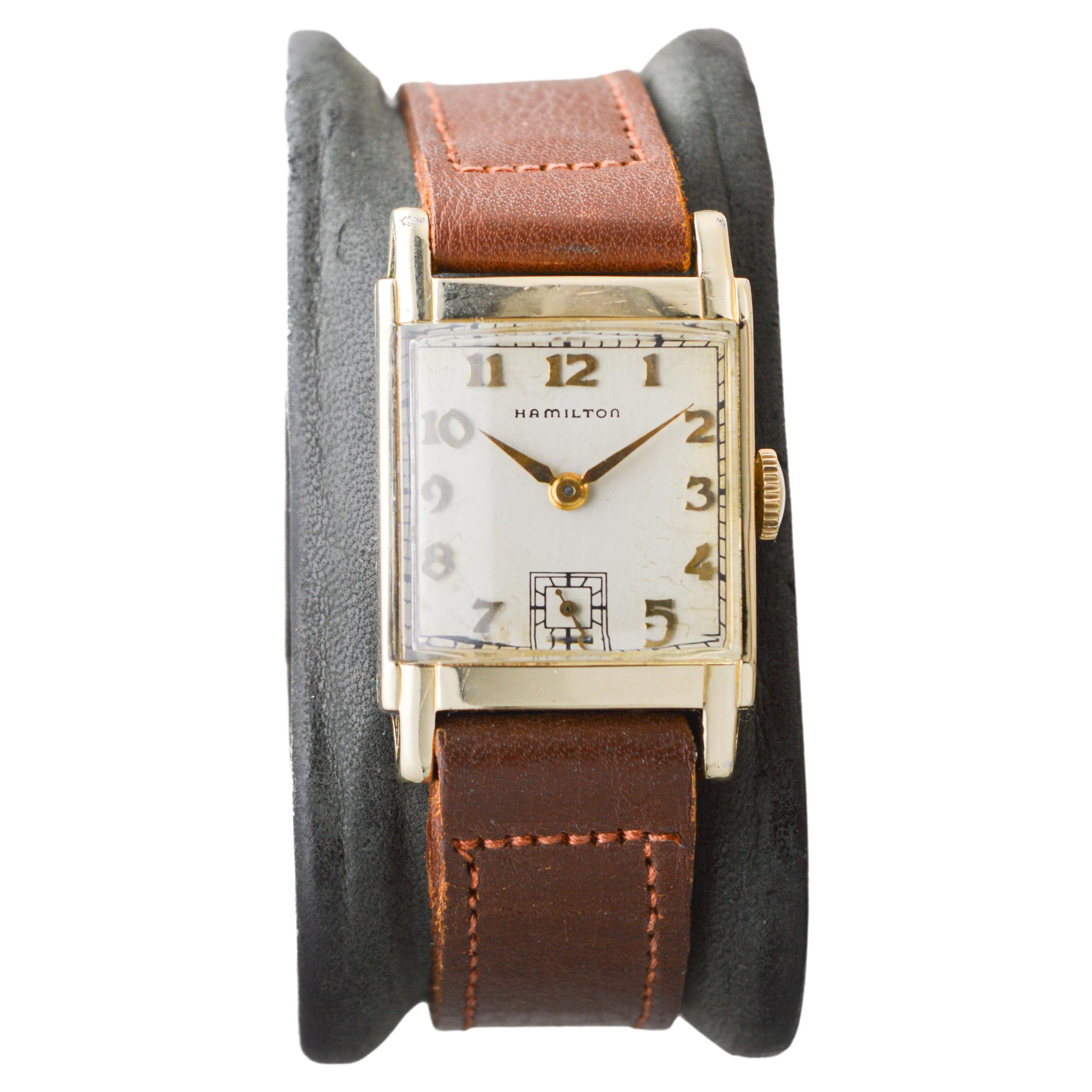 FACTORY / HOUSE: Hamilton Watch Company
STYLE / REFERENCE: Art Deco / Tank Style
METAL / MATERIAL: Yellow Gold Filled 
CIRCA / YEAR: Early 1940's
DIMENSIONS / SIZE: Length 35mm x Width 23mm
MOVEMENT / CALIBER: Manual Winding / 19 Jewels / Caliber