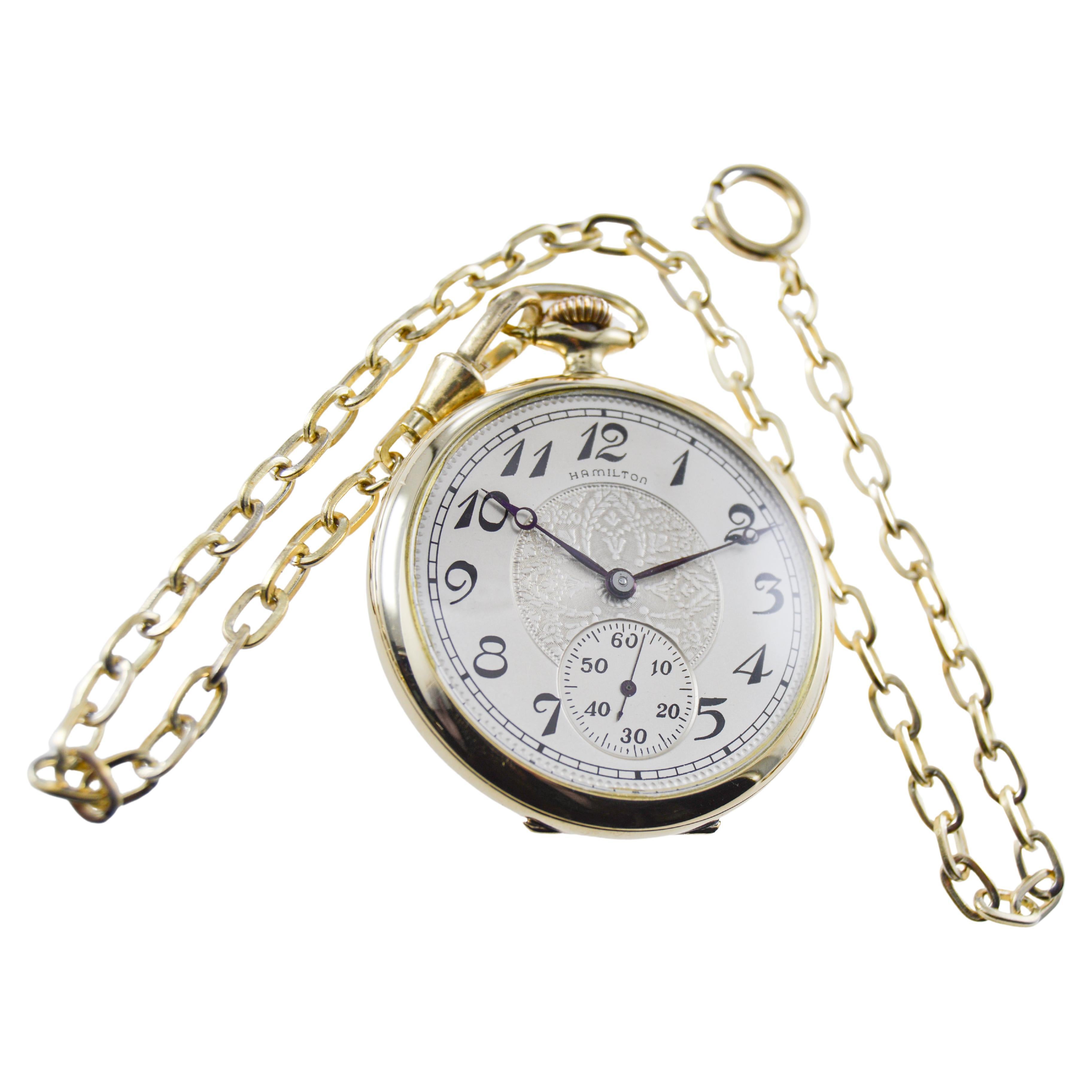 FACTORY / HOUSE: Hamilton Watch Company
STYLE / REFERENCE: Open Faced Pocket Watch 
METAL / MATERIAL: Yellow Gold Filled 
CIRCA / YEAR: 1917
DIMENSIONS / SIZE: Diameter 45mm 
MOVEMENT / CALIBER: Manual Winding / 17 Jewels / Caliber 910
DIAL / HANDS: