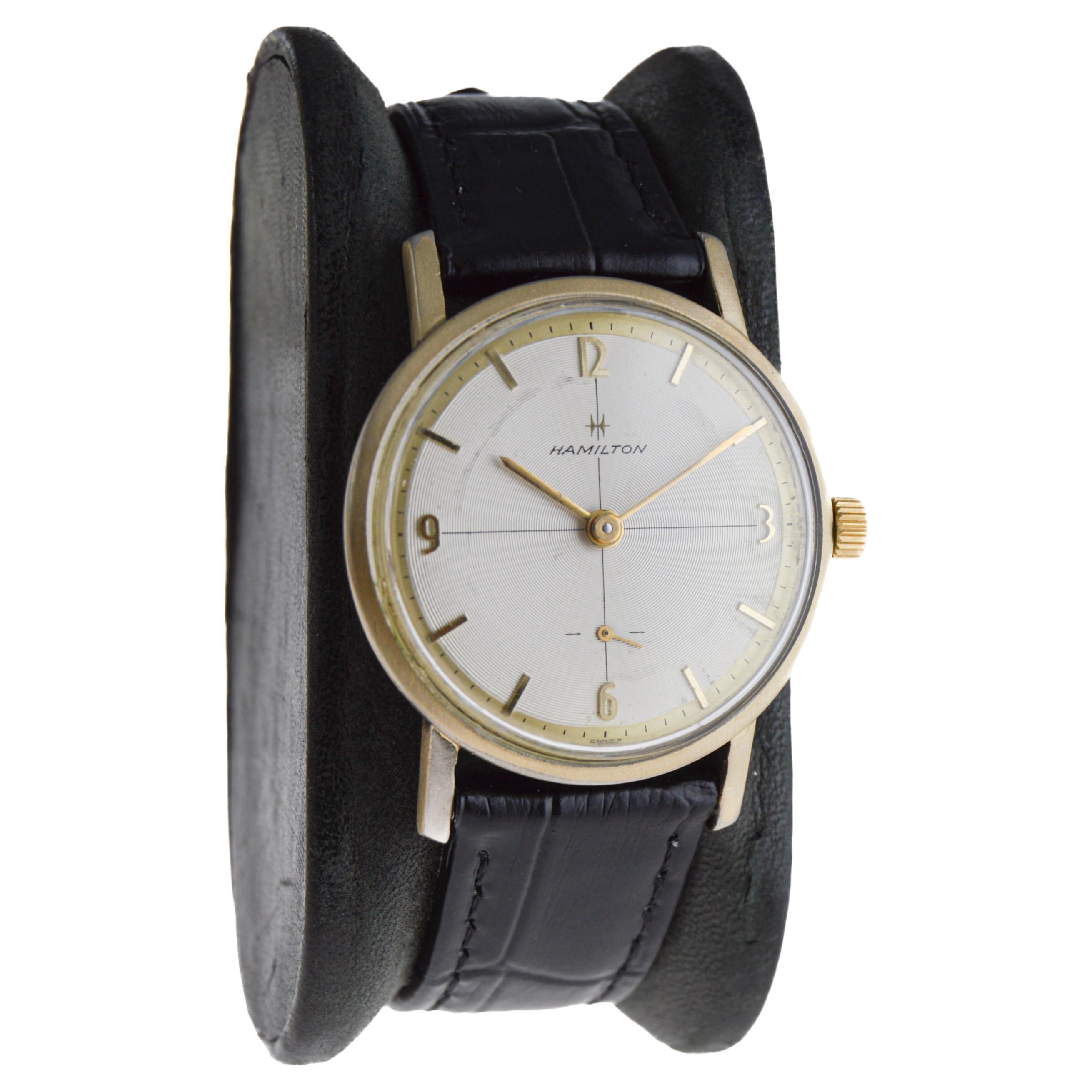 FACTORY / HOUSE: Hamilton Watch Company
STYLE / REFERENCE: Modern / Dress Style 
METAL / MATERIAL: Yellow Gold-Filled
CIRCA / YEAR: 1950's
DIMENSIONS / SIZE: Length 33mm X Diameter 22mm
MOVEMENT / CALIBER: Manual Winding / 17 Jewels / Caliber