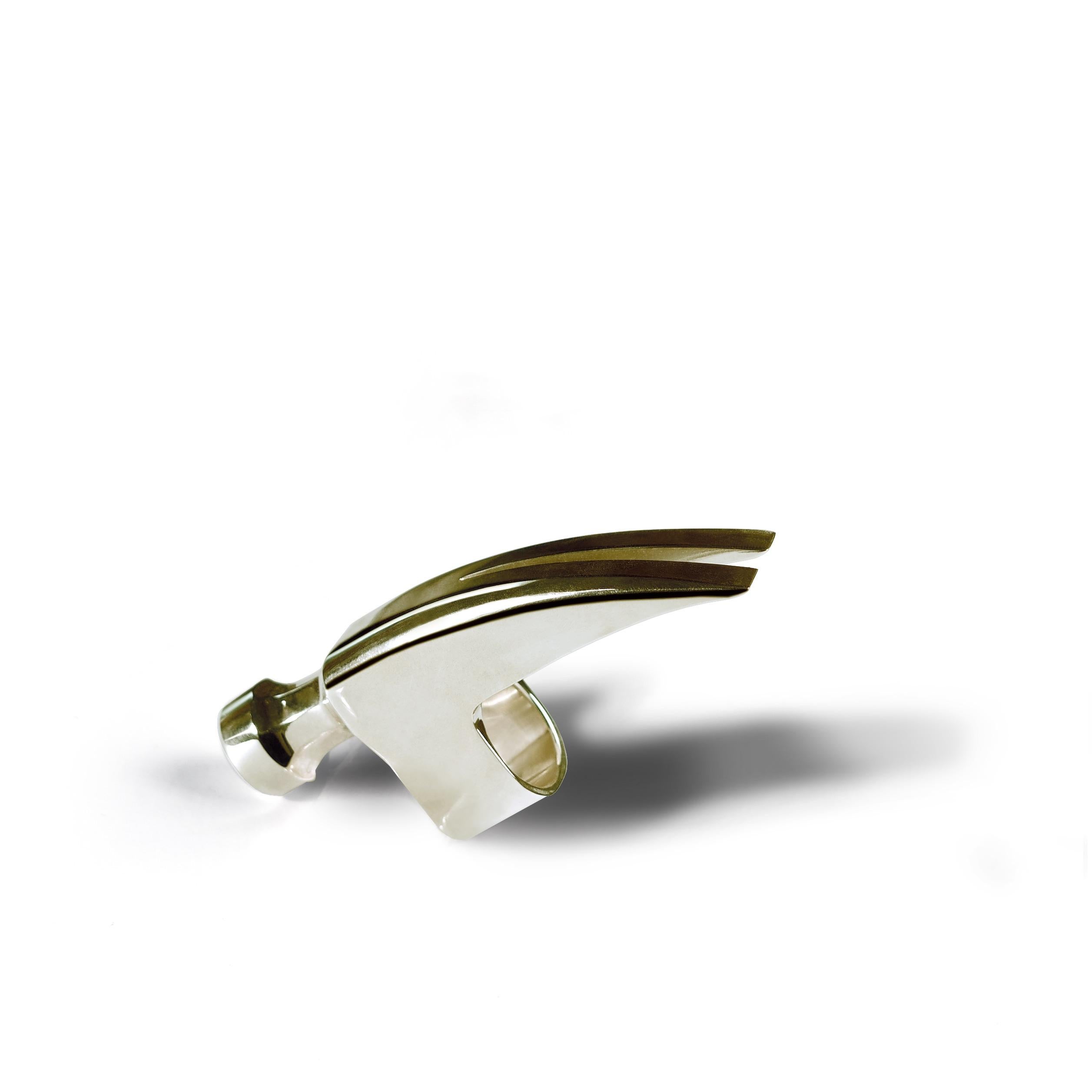 Metal banded ring in solid, hypoallergenic Stainless Steel. Wear with the hammer head facing your fingertips on the ring, index, or pointer fingers. Limited edition of 10 rings available. 

FEATURES
- Made of hypoallergenic, surgical-grade 316L