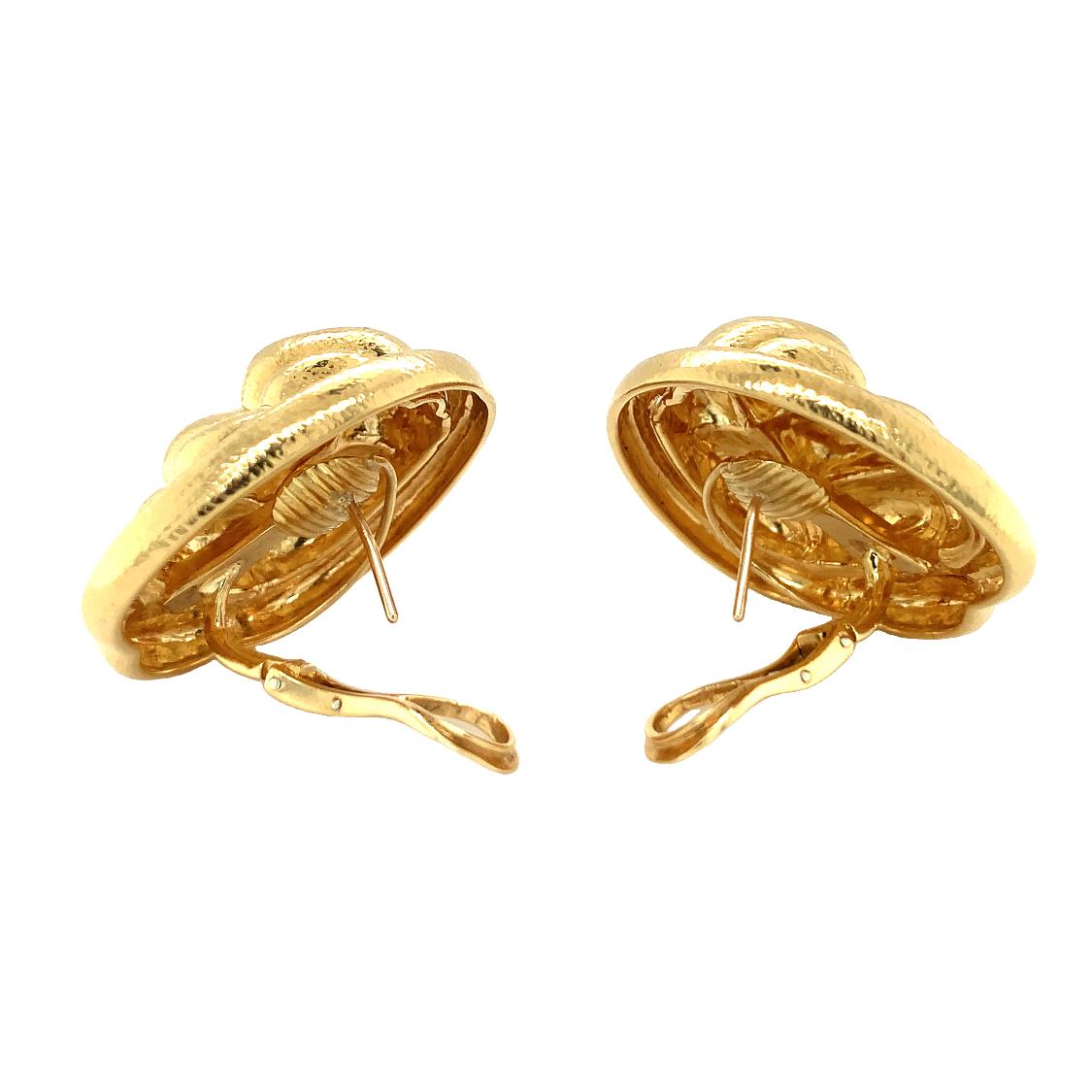 One pair of finely hammered 18K yellow gold earrings in an abstract oval shape, with posts and backs. Circa 1960s.

Glowing, grand, gorgeous.

Additional Information:
Metal: 18K yellow gold
Circa: 1960s
Stamp/Hallmark: 750
Size/Measurements: 36