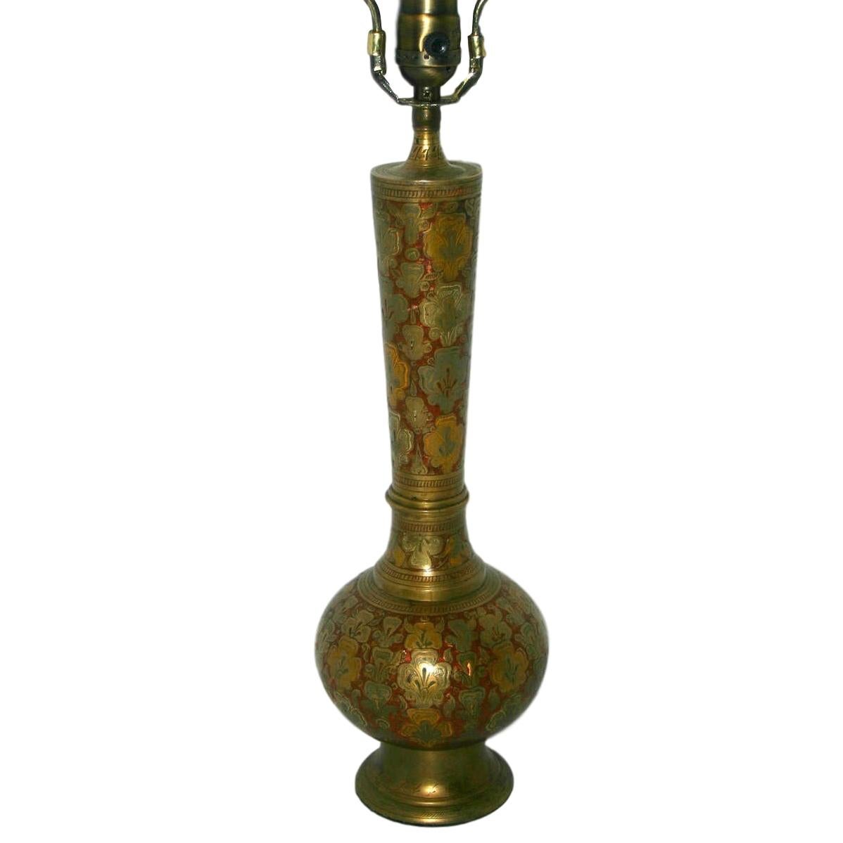 A single circa 1930's Turkish hammered and enameled brass table lamp with foliage and floral motif on body.

Measurements:
Height of body: 15.5
