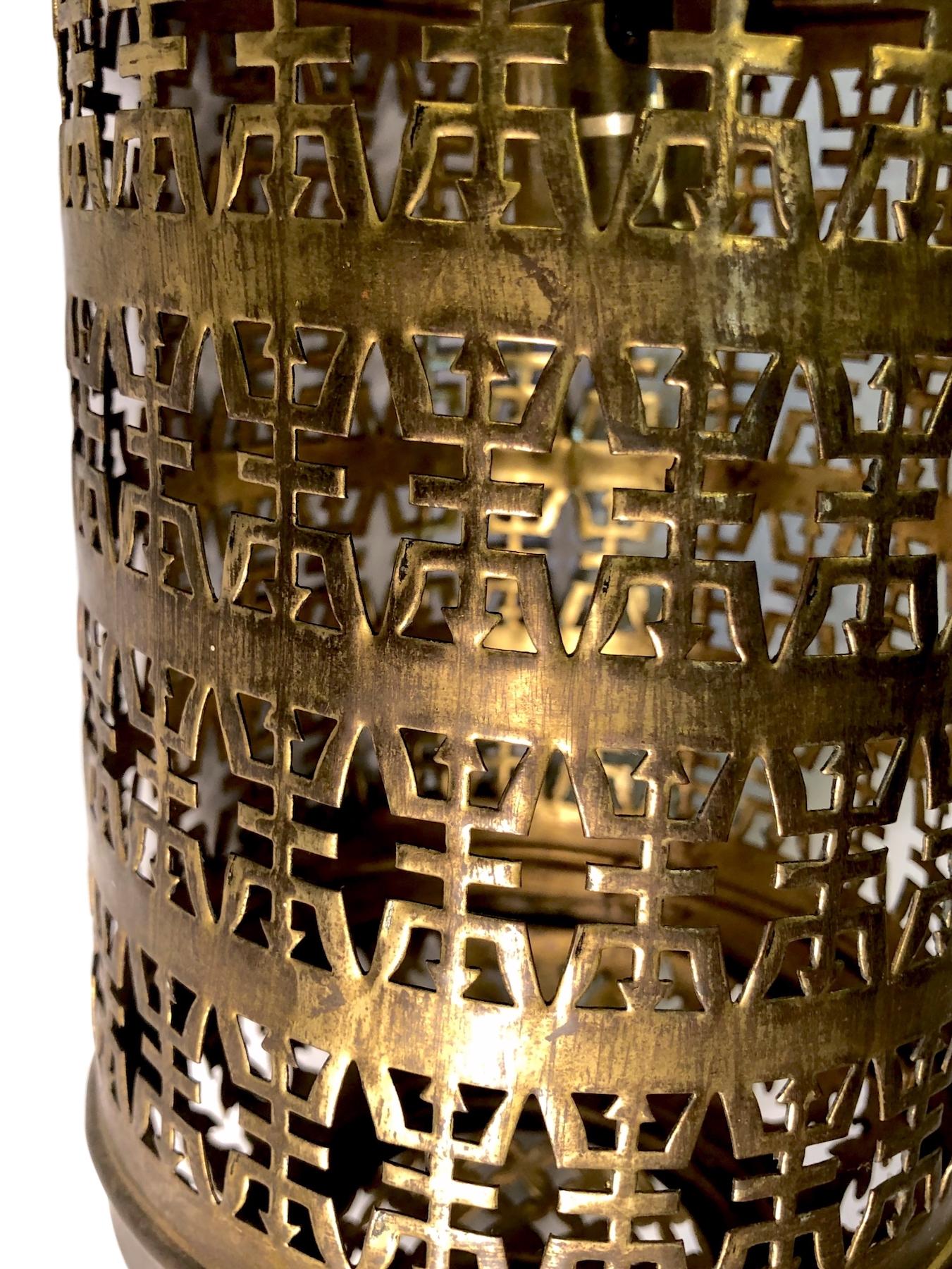 A circa 1950s Moroccan hammered and pierced metal lantern with interior light.

Measurements:
Height (of body): 18