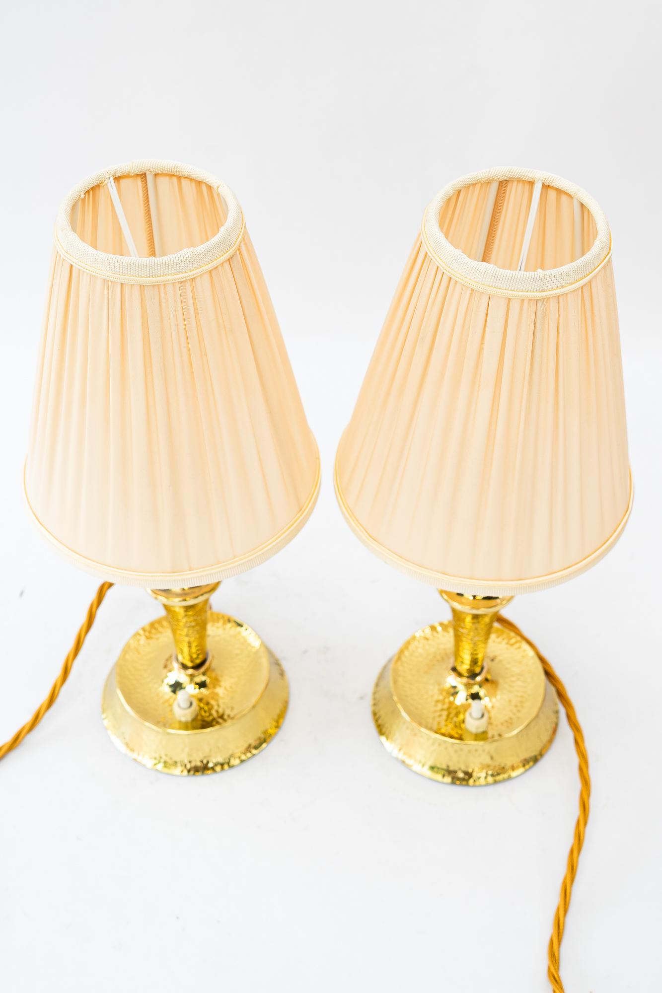 Hammered art deco brass table lamp with fabric shades vienna around 1920s
Brass polished and stove enameled
The fabric shade is replaced ( new )