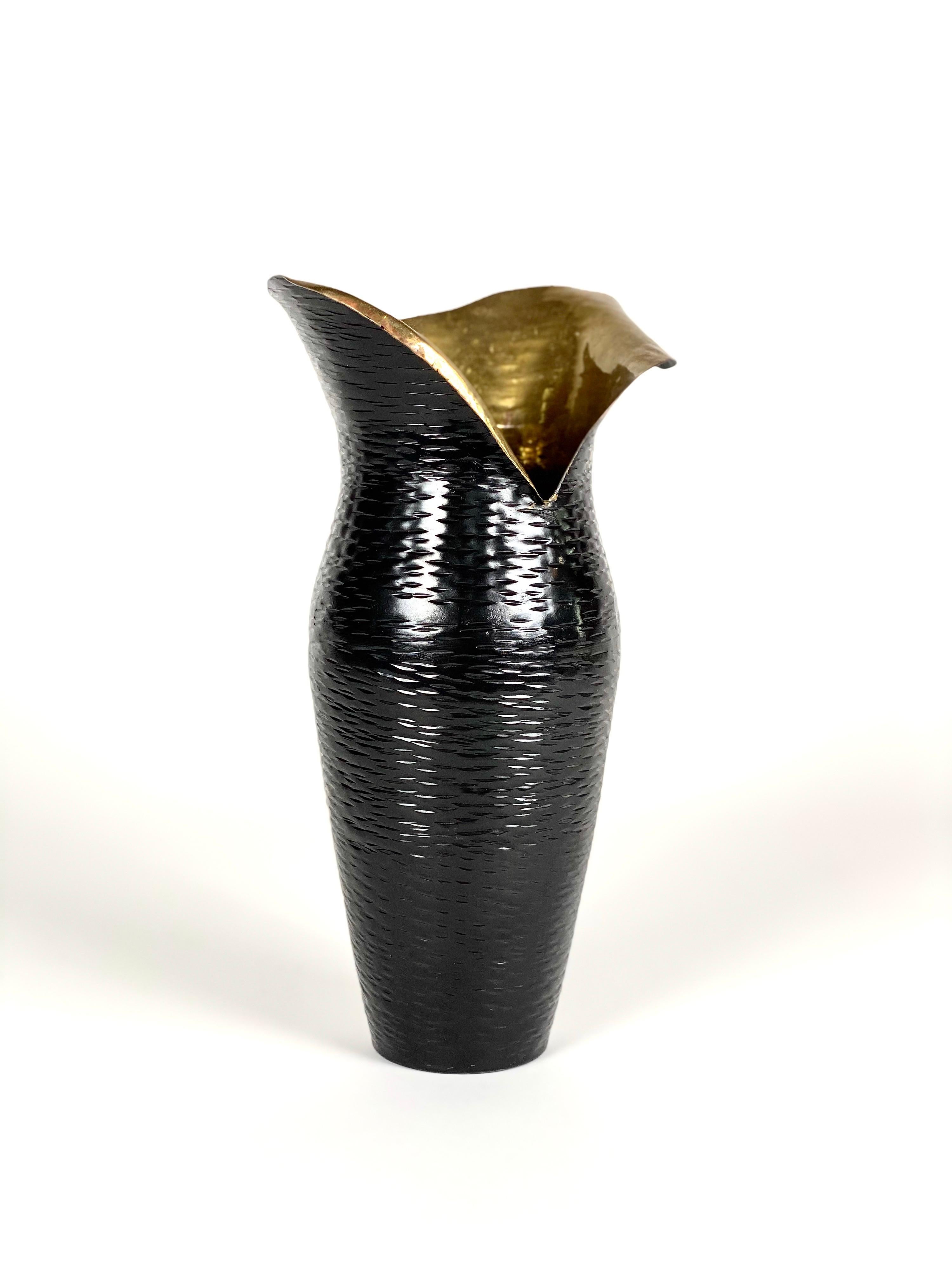 Hammered black brass vase

Size: 9