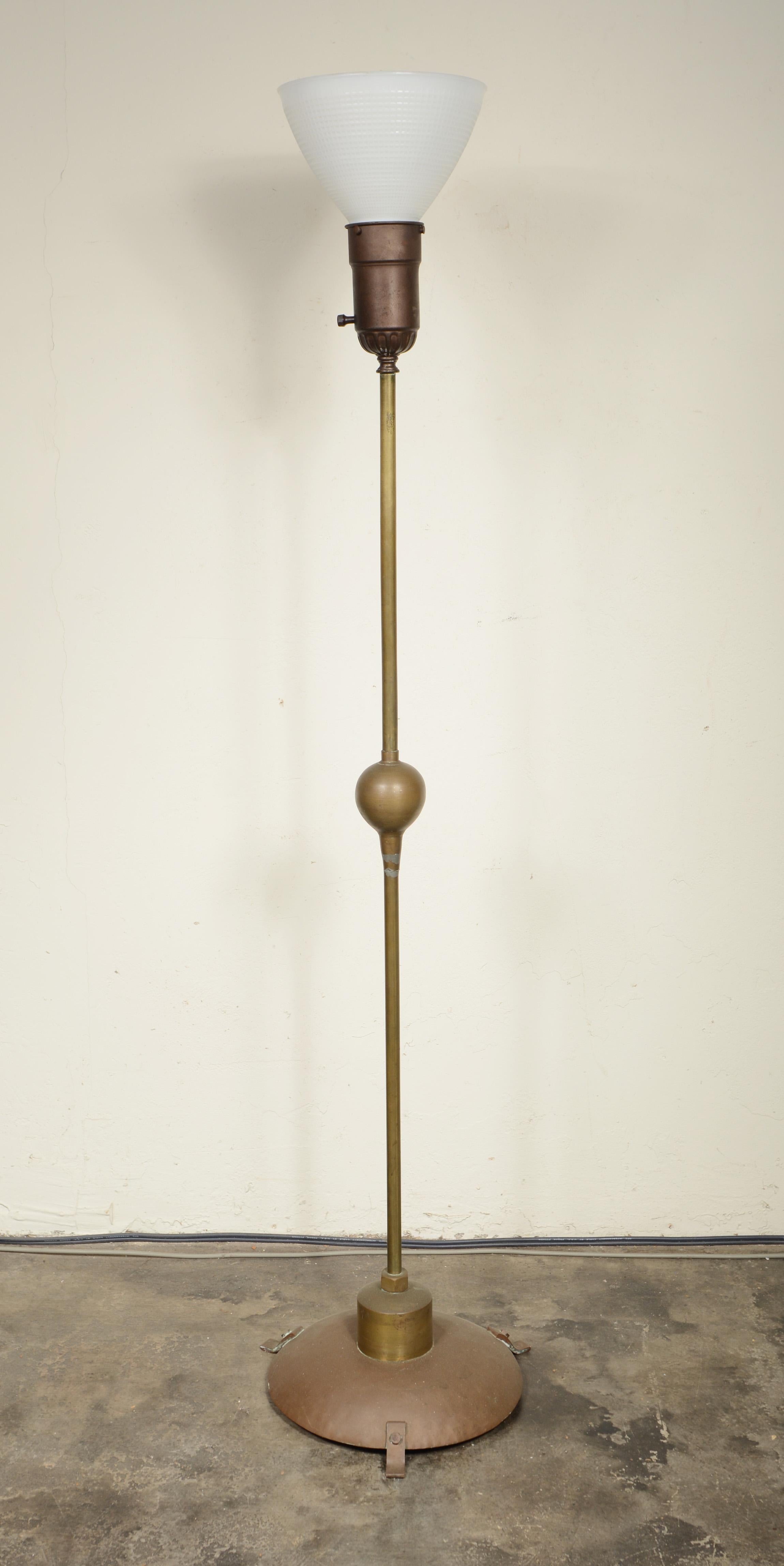 Amateur craftsman made modernist floor lamp. The lamp is a little arts and crafts, art deco and machine age combined. A great imaginative form, the lamp is made of found brass pieces with solder filling some holes and imperfections. The dish base