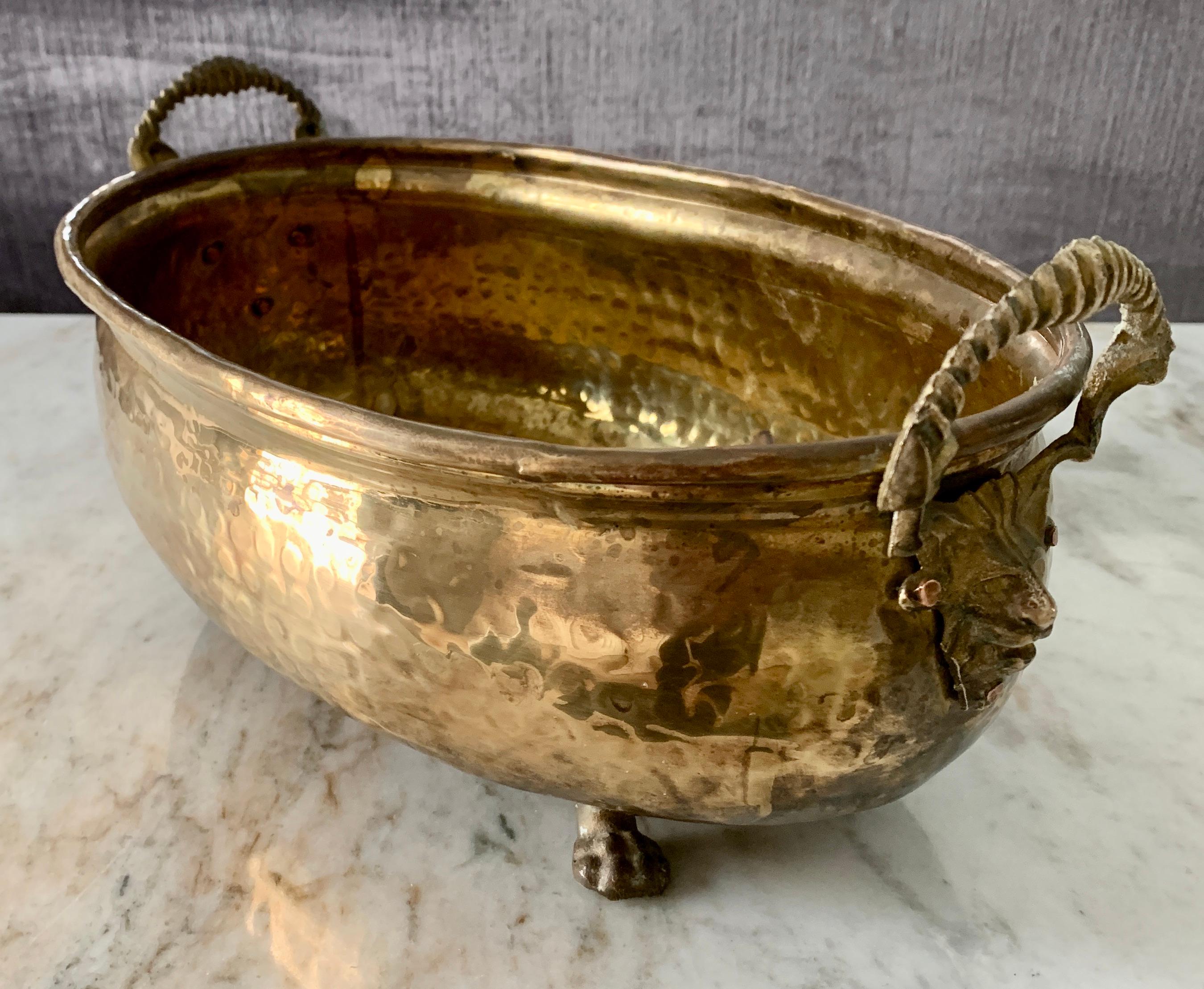 brass planter with lion head handles