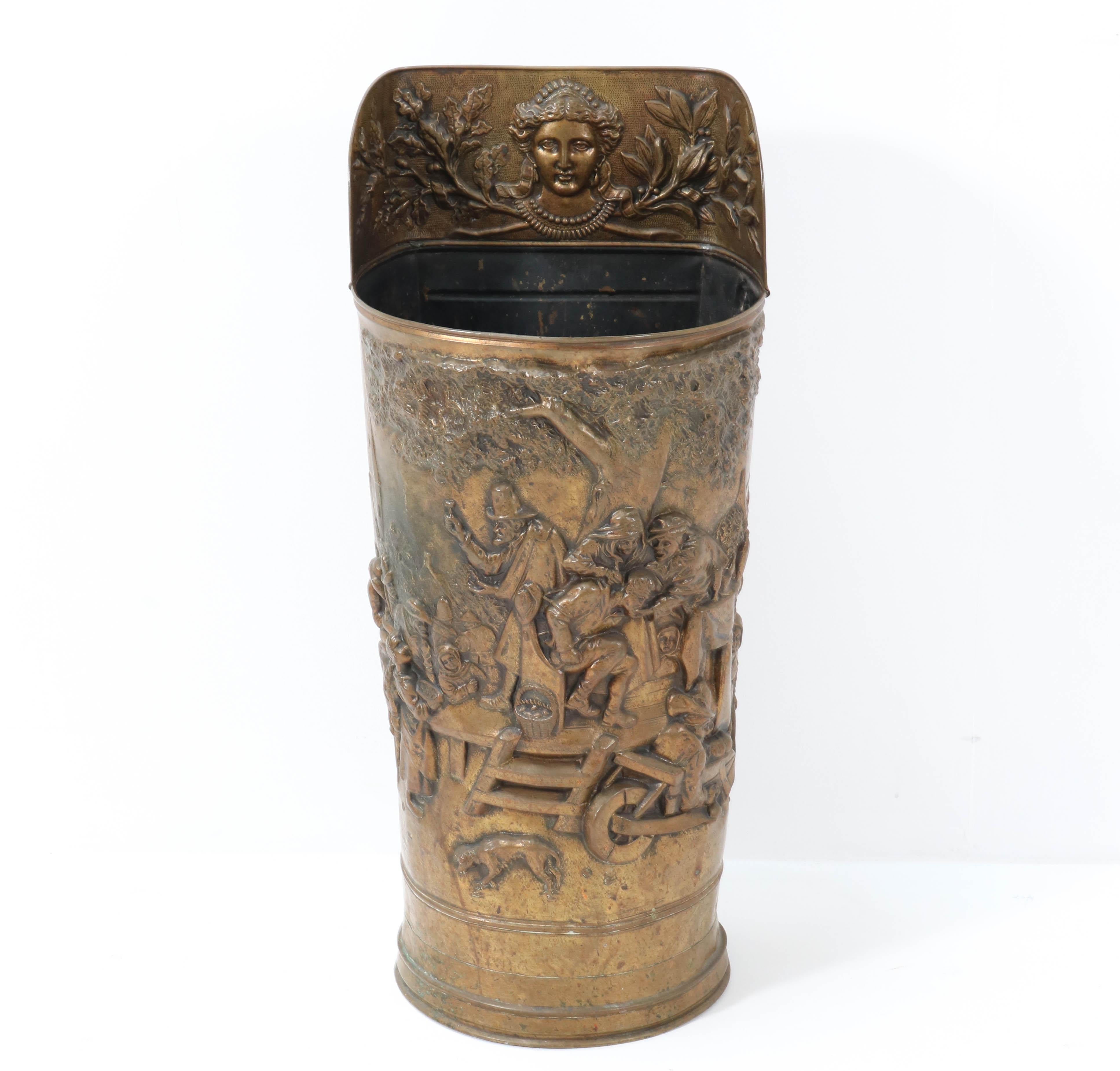 Stunning Renaissance Revival style umbrella stand or stick holder.
Striking Dutch design from the 1920s.
Hammered brass with a female head and other decorations.
This wonderful piece of furniture is a true gem in the hall way!
In very good