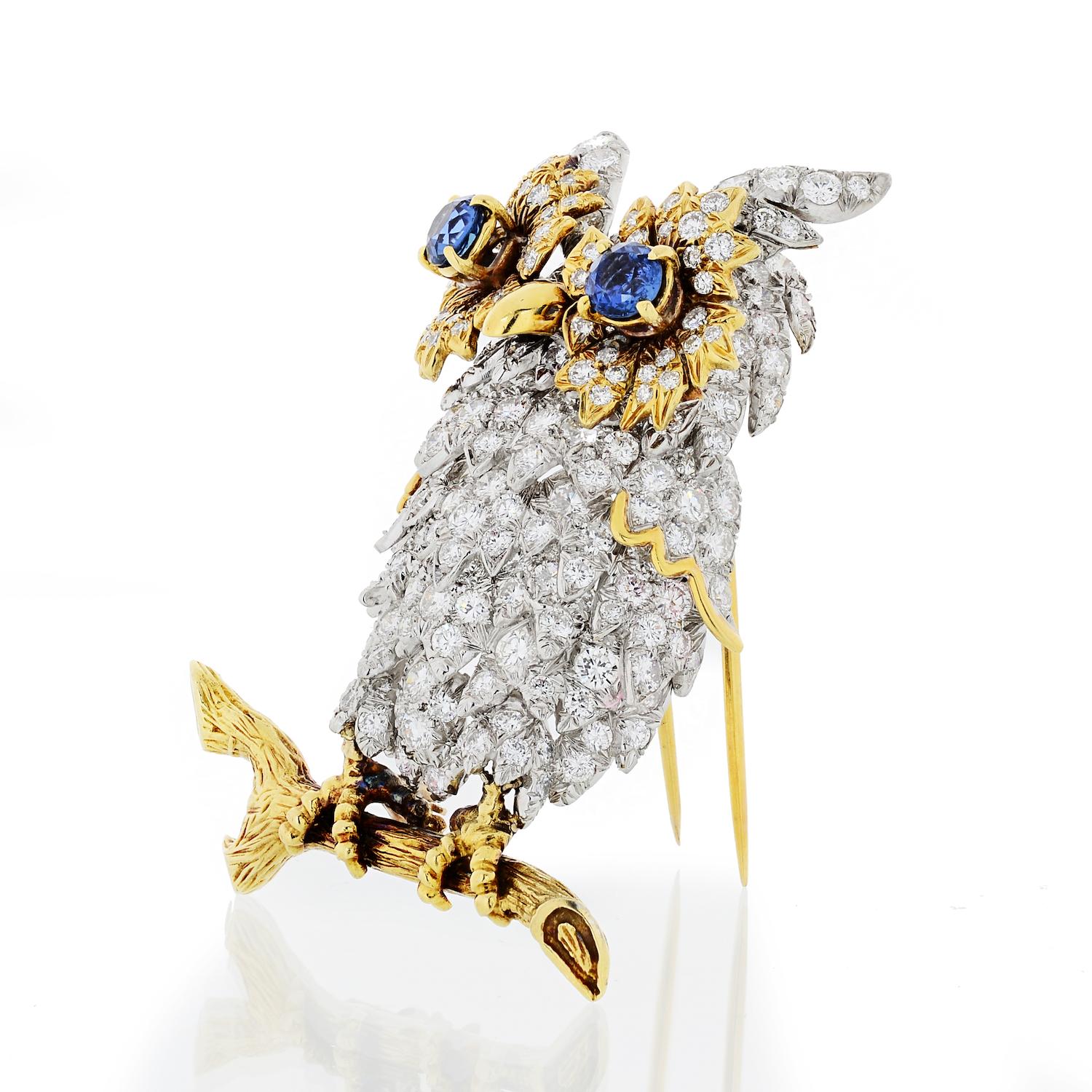 Beautiful and friendly this vintage Hammerman Brothers 18k yellow and Platinum Owl brooch with Diamond pave body and genuine blue gemstones. She is sitting on a branch just a real owl in wild. Hammerman Brothers are known for their exceptional