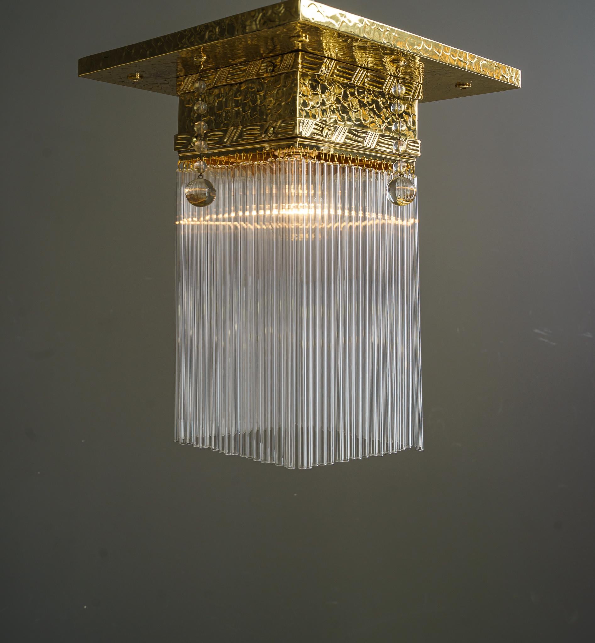 Brass Hammered Ceiling Lamp with Glass Sticks Vienna Around 1920  For Sale