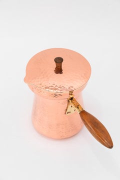 Hammered copper, brass, and wood can around 1920s