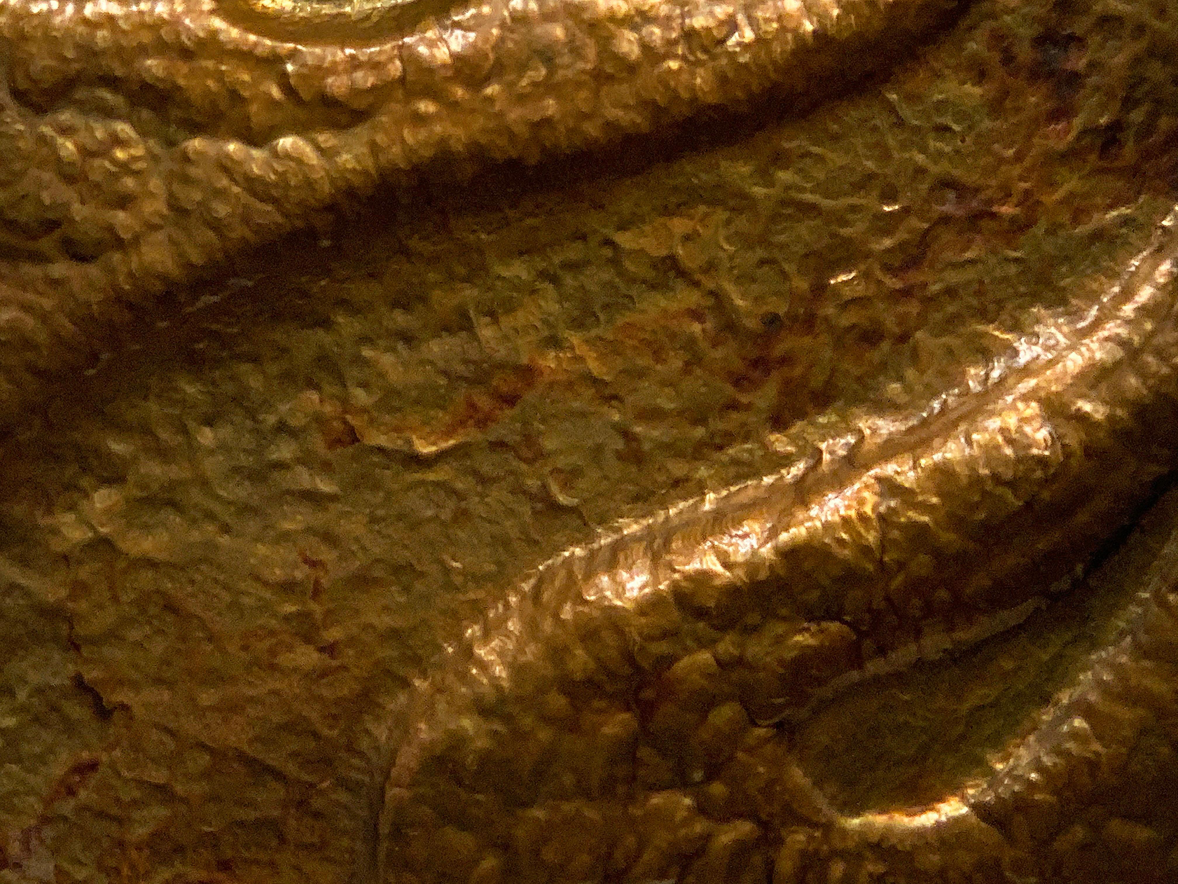 Hammered copper wall relief by W.R.E., 1969. This undulating artwork has a nice hammered texture and patina. Framed in rustic wood frame. Signed and dated on reverse.
