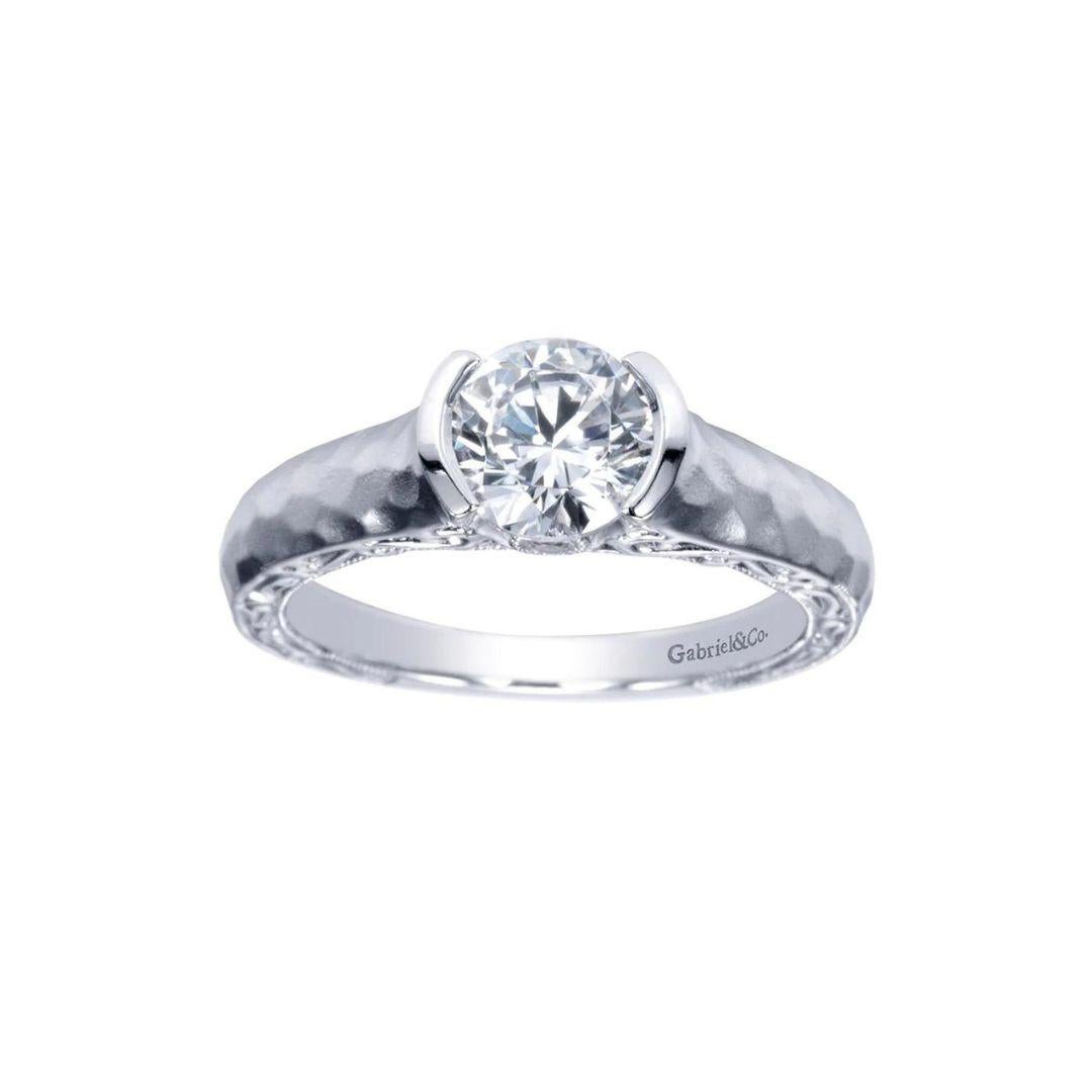 Hammered Finish Contemporary Solitaire Diamond Engagement Mounting. Satin finish and hammered finish give this semi bezel mounting a contemporary and modern look with a twist. Subtle filigree in the undercarriage leads up to a small diamond on both