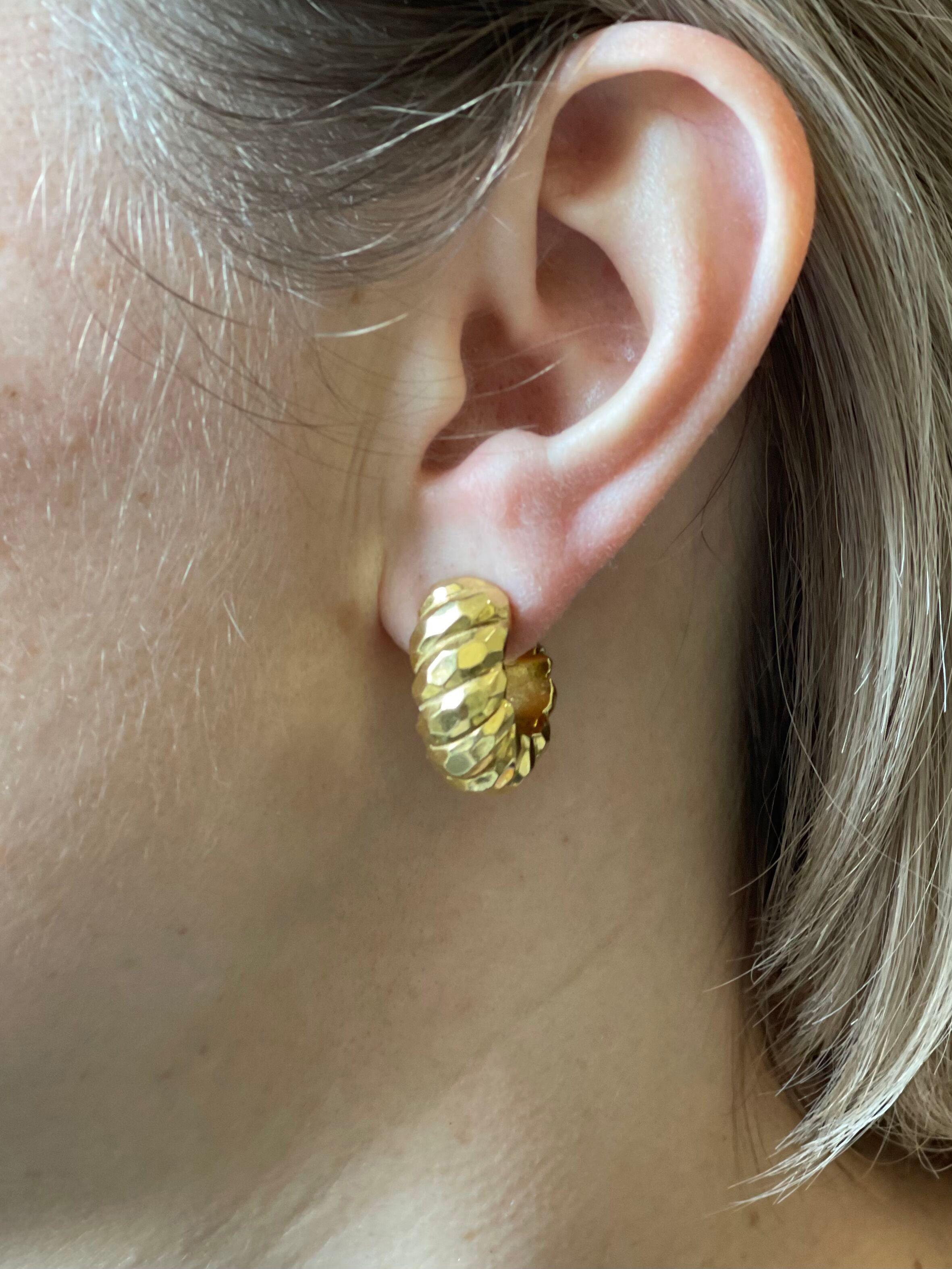 Pair of 18k gold hammered finish hoop earrings. Measuring 7/8