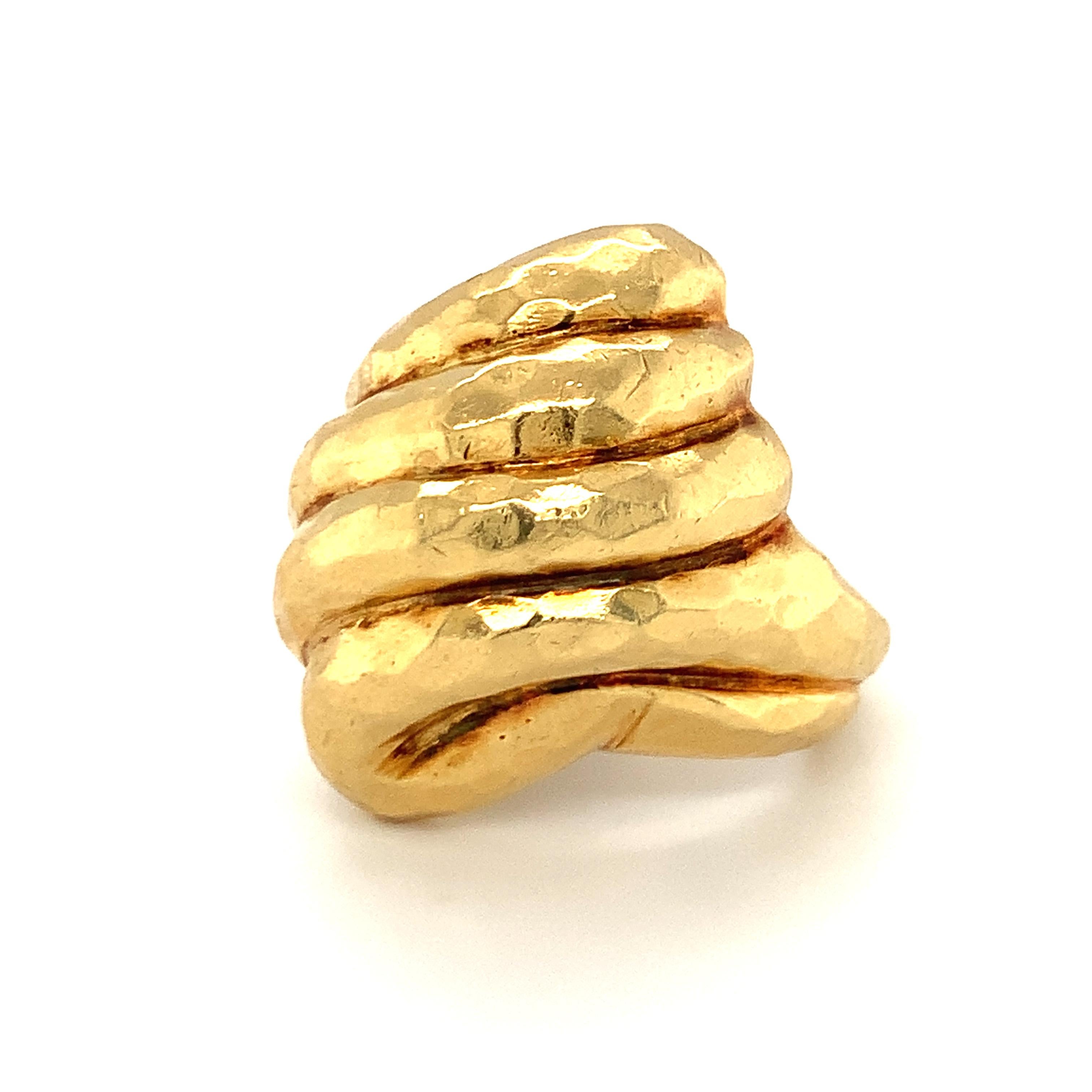 One hammered 18K yellow gold ring with textured, high polish finish throughout in the Henry Dunay style. The ring features a marquise shape measuring 28 x 22 millimeters across the top portion.

Lustrous, substantial, dramatic.

Metal: 18K yellow