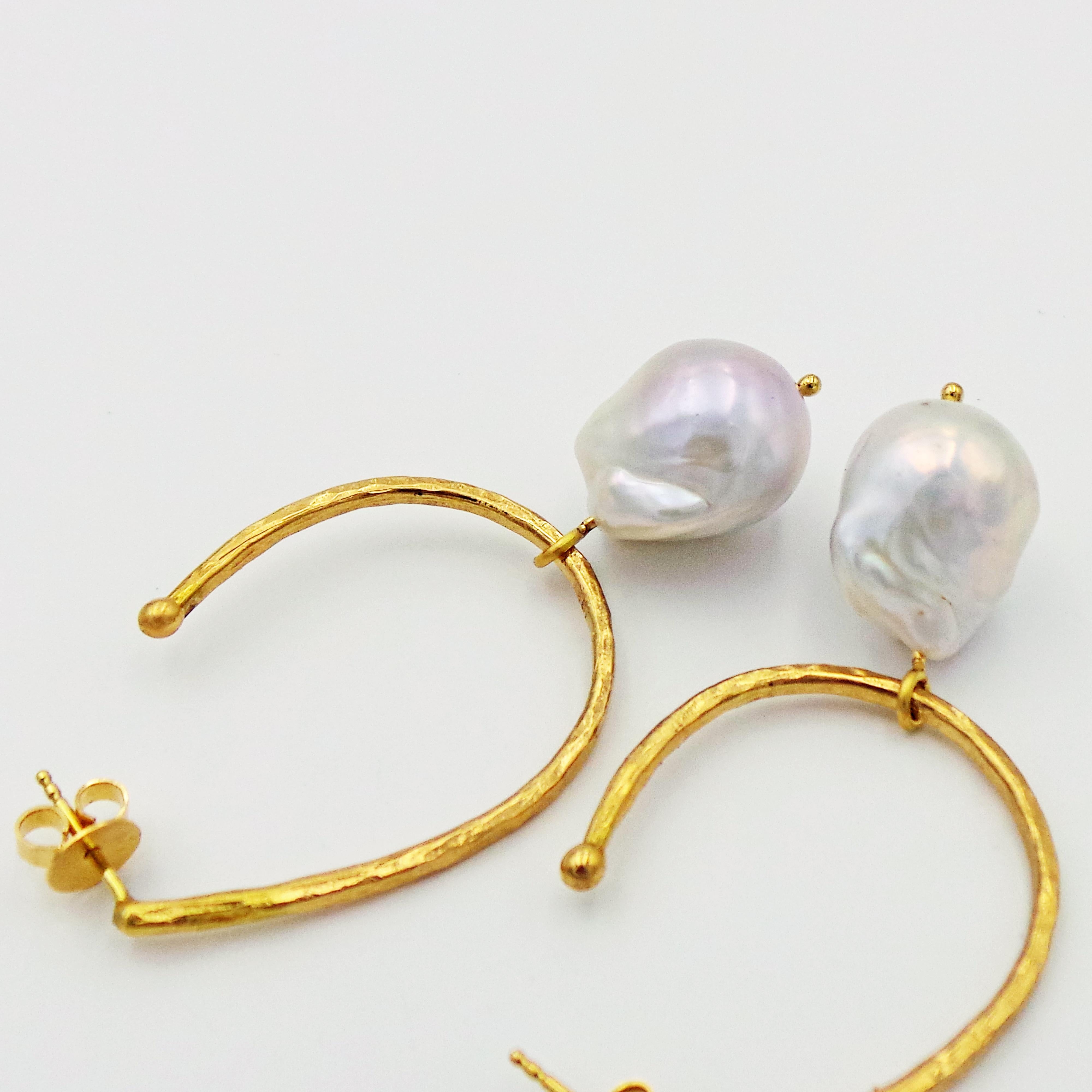 Hammered 18k yellow gold elongated hoop stud earrings with Freshwater Baroque Pearls and 18k yellow gold charms.  Charms may be removed, and the hoops may be worn by themselves, providing two styles to choose from. Gorgeous, unique and versatile